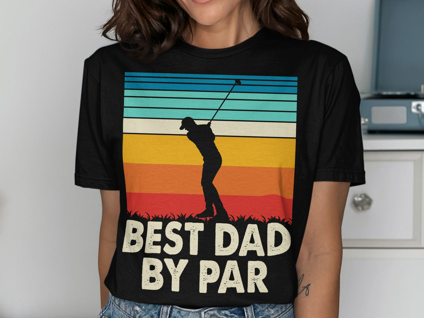 Black t-shirt with silhouette of golfer and "BEST DAD BY PAR" text.