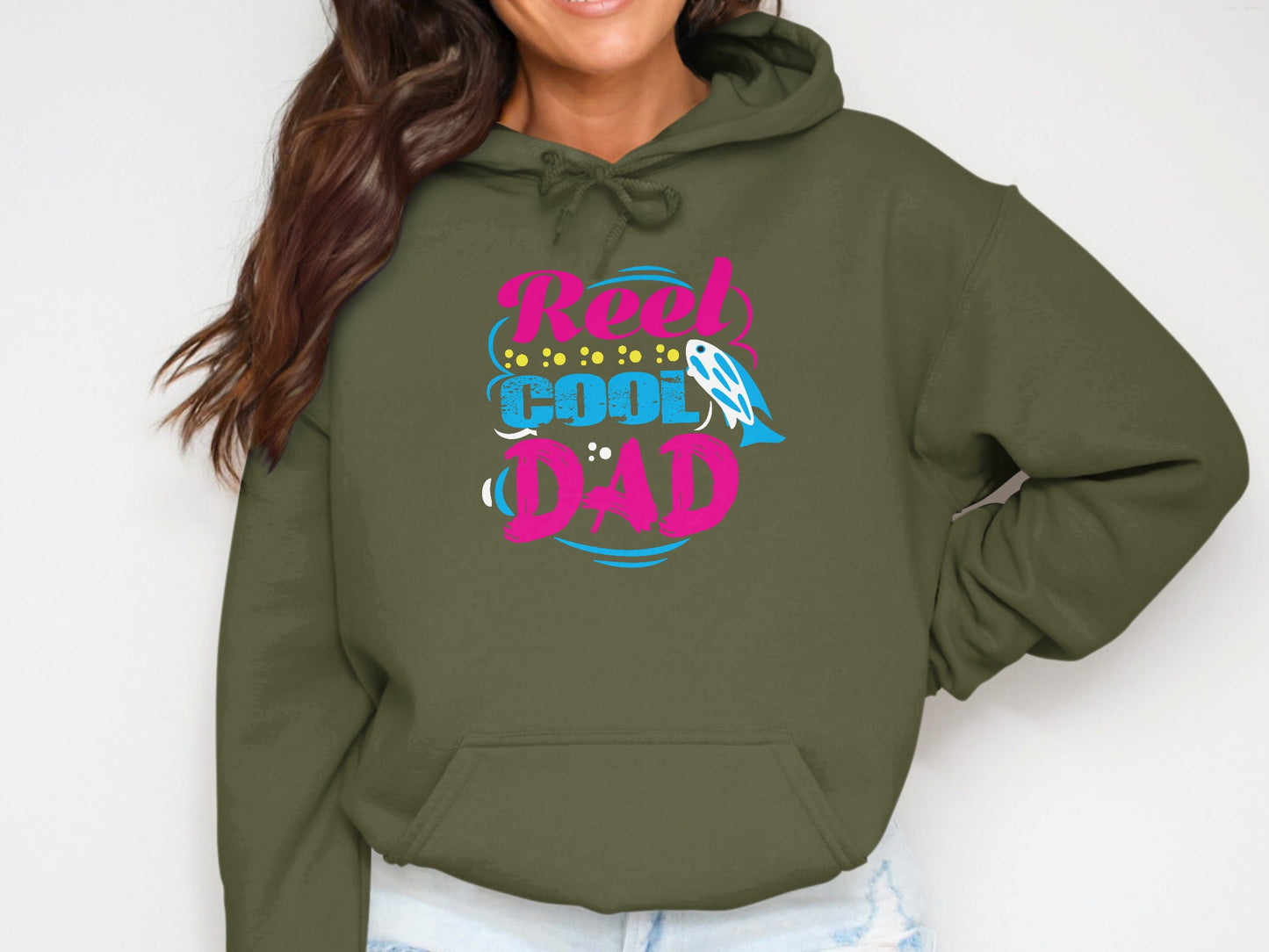 Green hoodie with "Reel Cool Dad" text and fishing lure graphic.