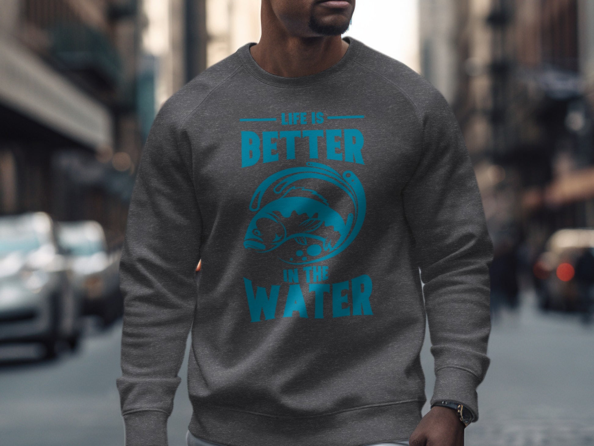 Gray sweatshirt with blue text "LIFE IS BETTER IN THE WATER" and fish graphic.