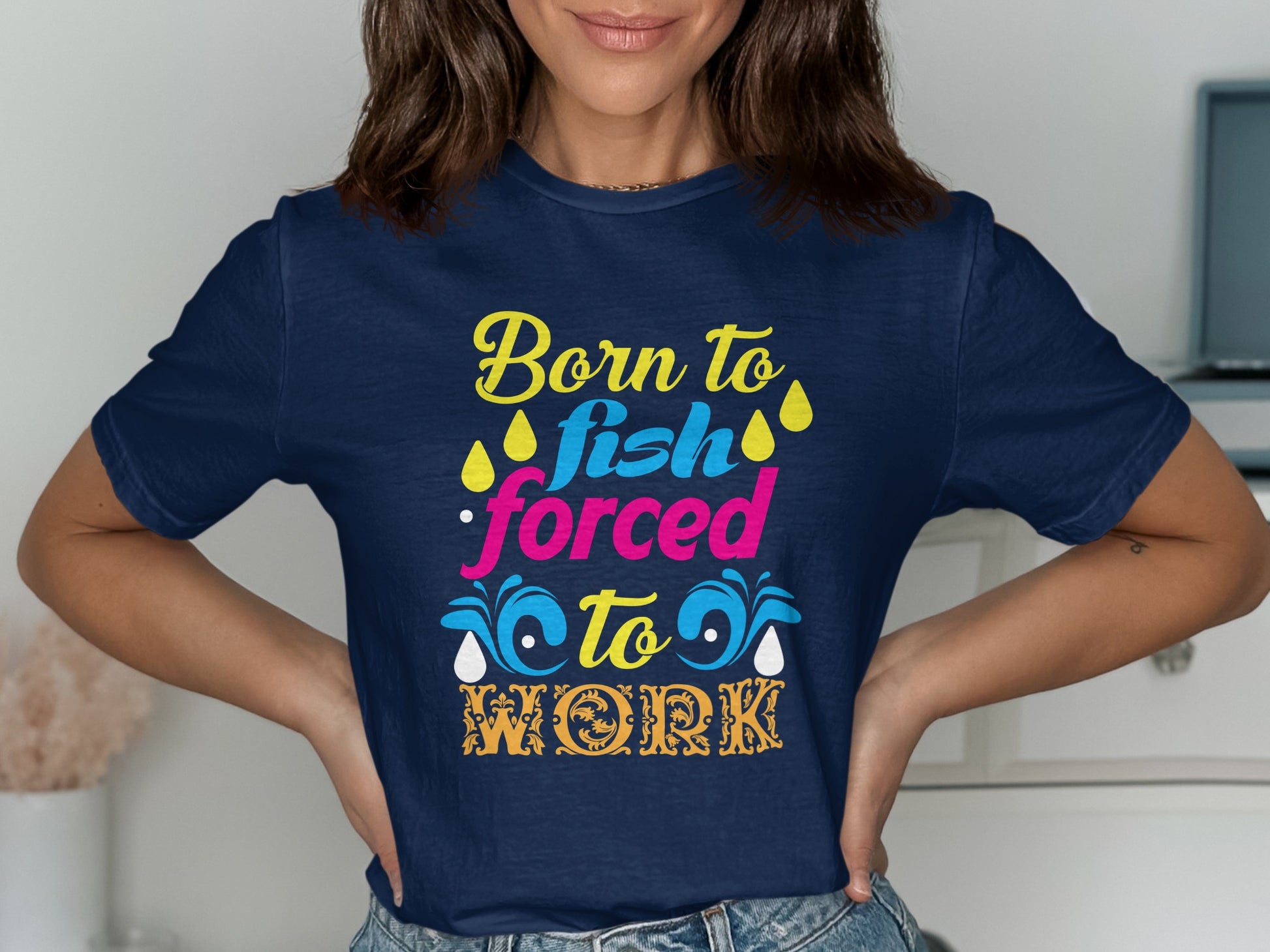 Navy t-shirt with "Born to Fish, Forced to Work" text and colorful graphics.