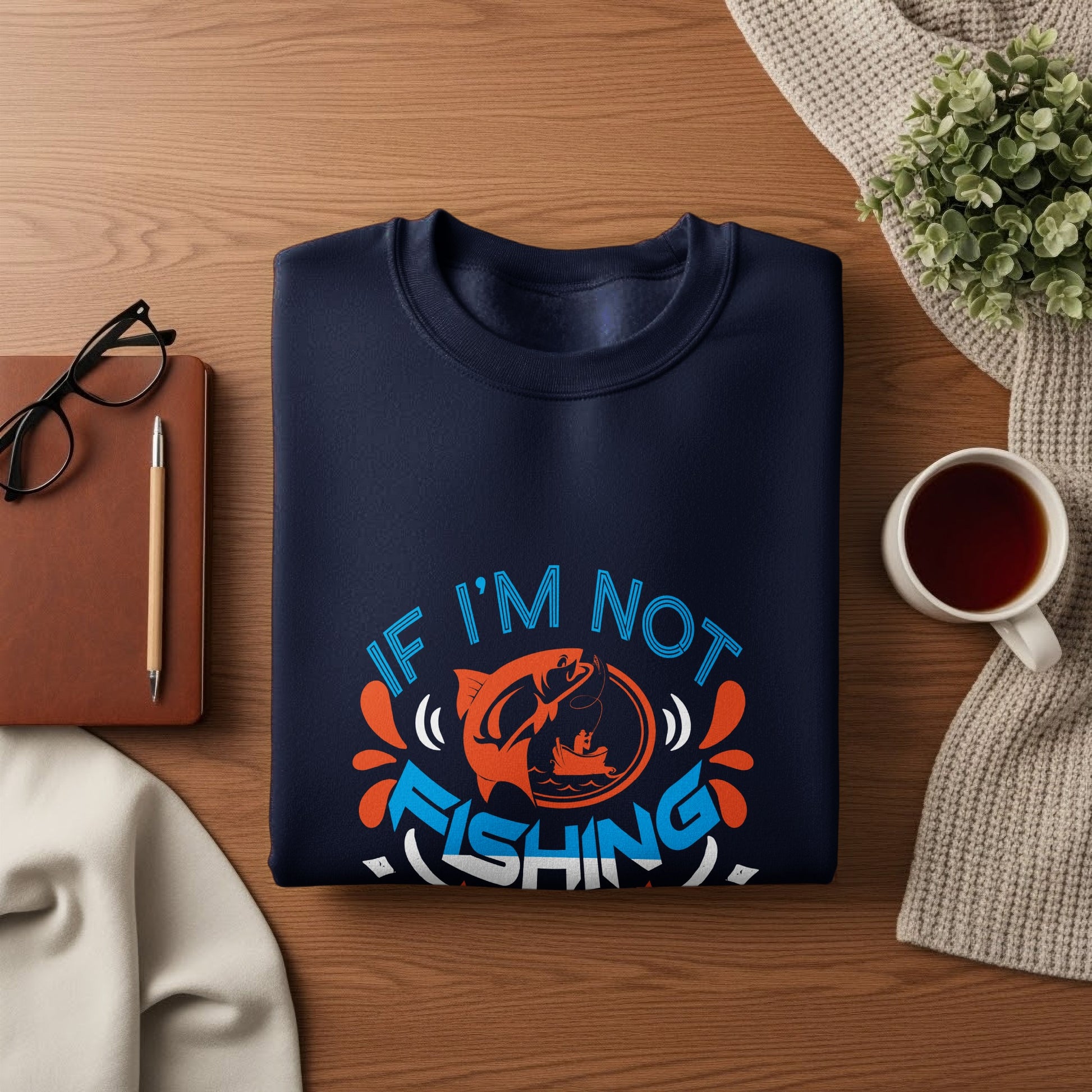 Navy sweatshirt with "If I'm not fishing" text and a fish graphic.