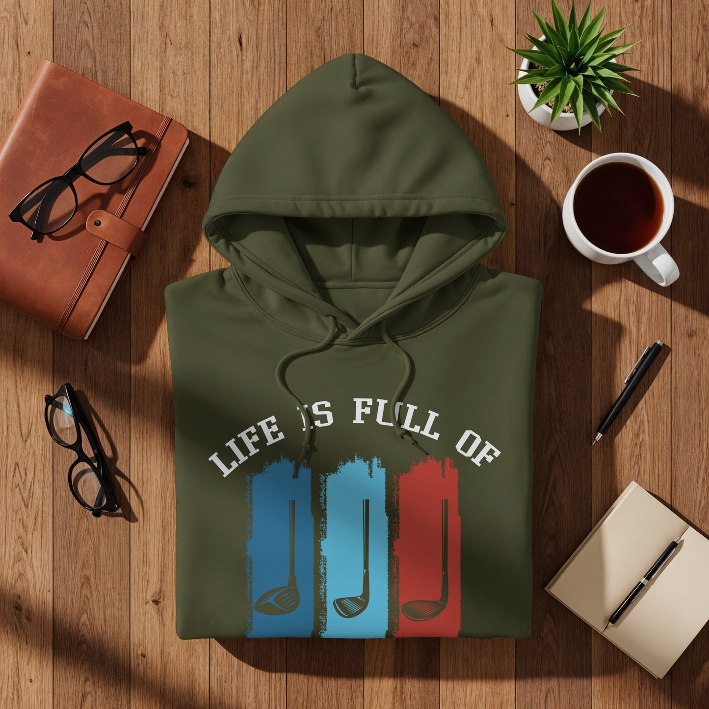Green hoodie with "Life is Full Of" and golf club graphics.