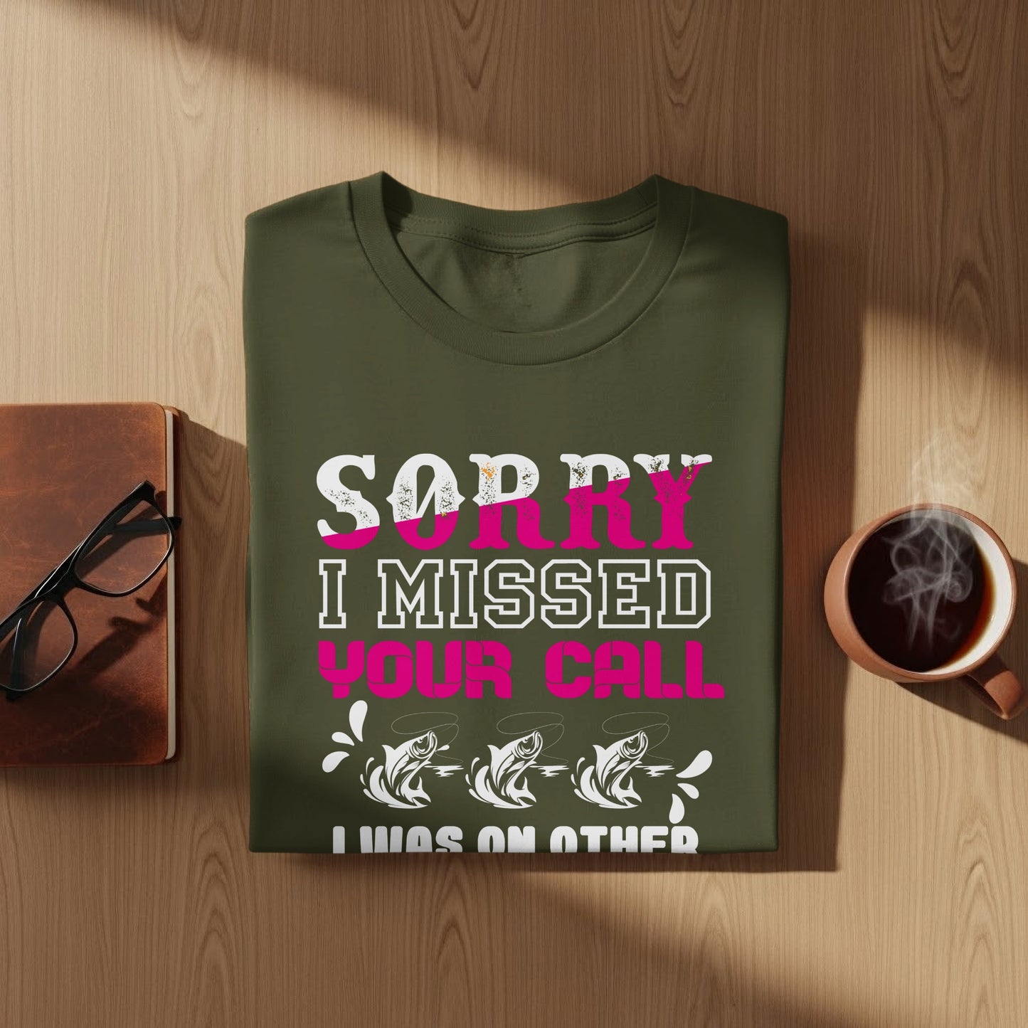 Green t-shirt with "Sorry I missed your call" and fish graphic.