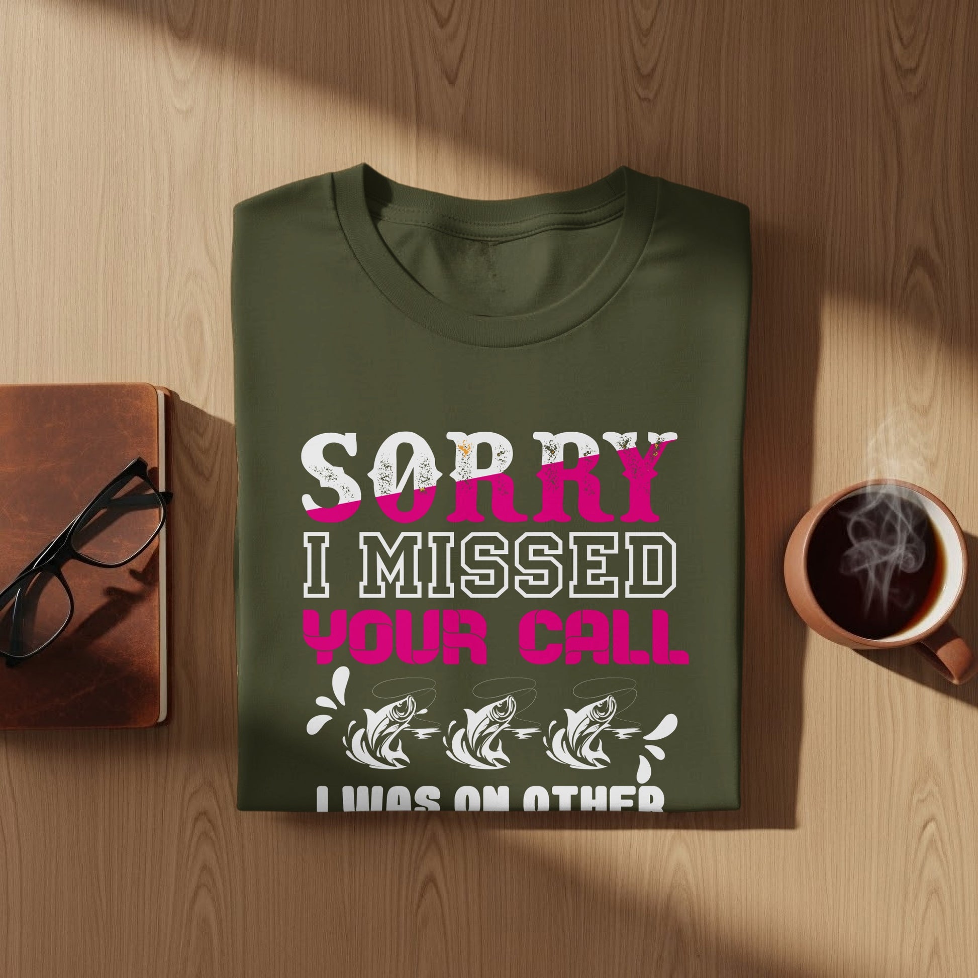 Green t-shirt with "Sorry I missed your call" and fish graphic.