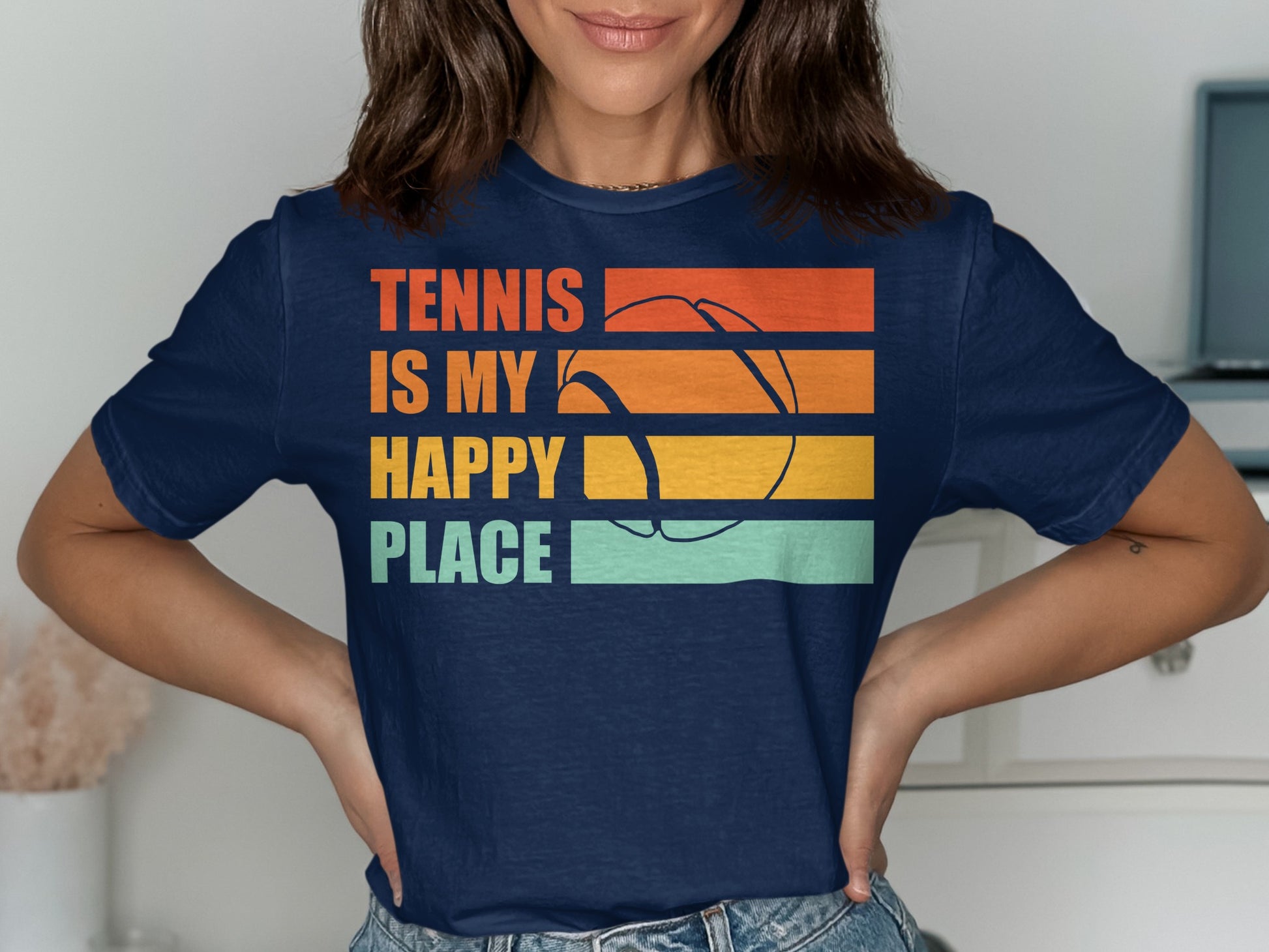 Navy t-shirt with "Tennis is my happy place" and tennis ball graphic.