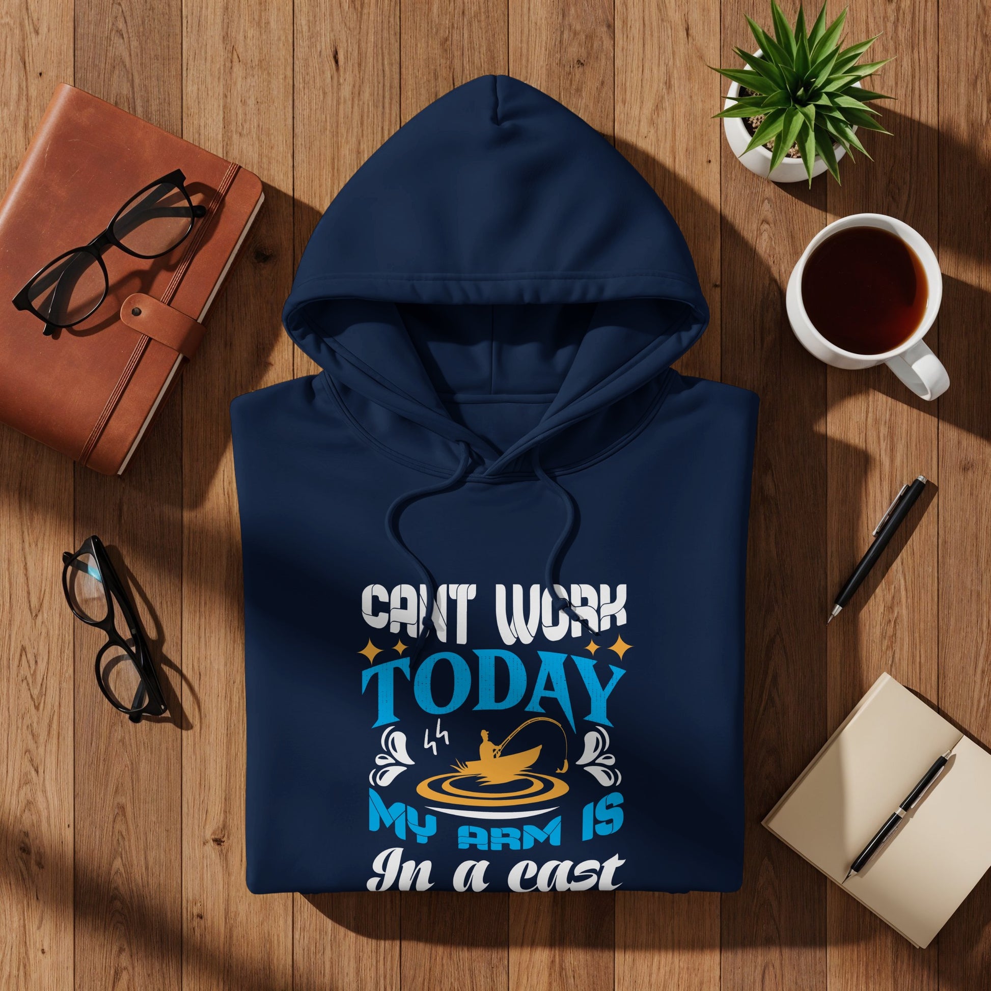 Navy hoodie with "Can't Work Today My Arm Is In A Cast" fishing graphic.
