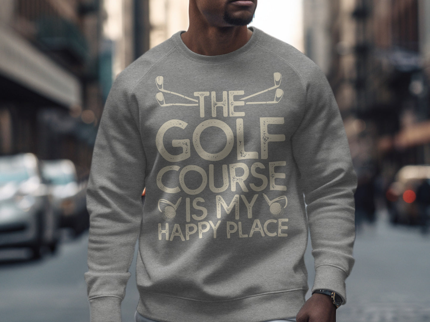 Grey sweatshirt with "The Golf Course is My Happy Place" text and golf club graphic.