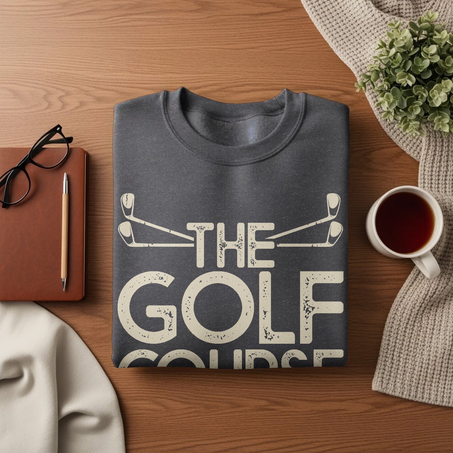 Dark grey sweatshirt with "THE GOLF COURSE" text printed in white.