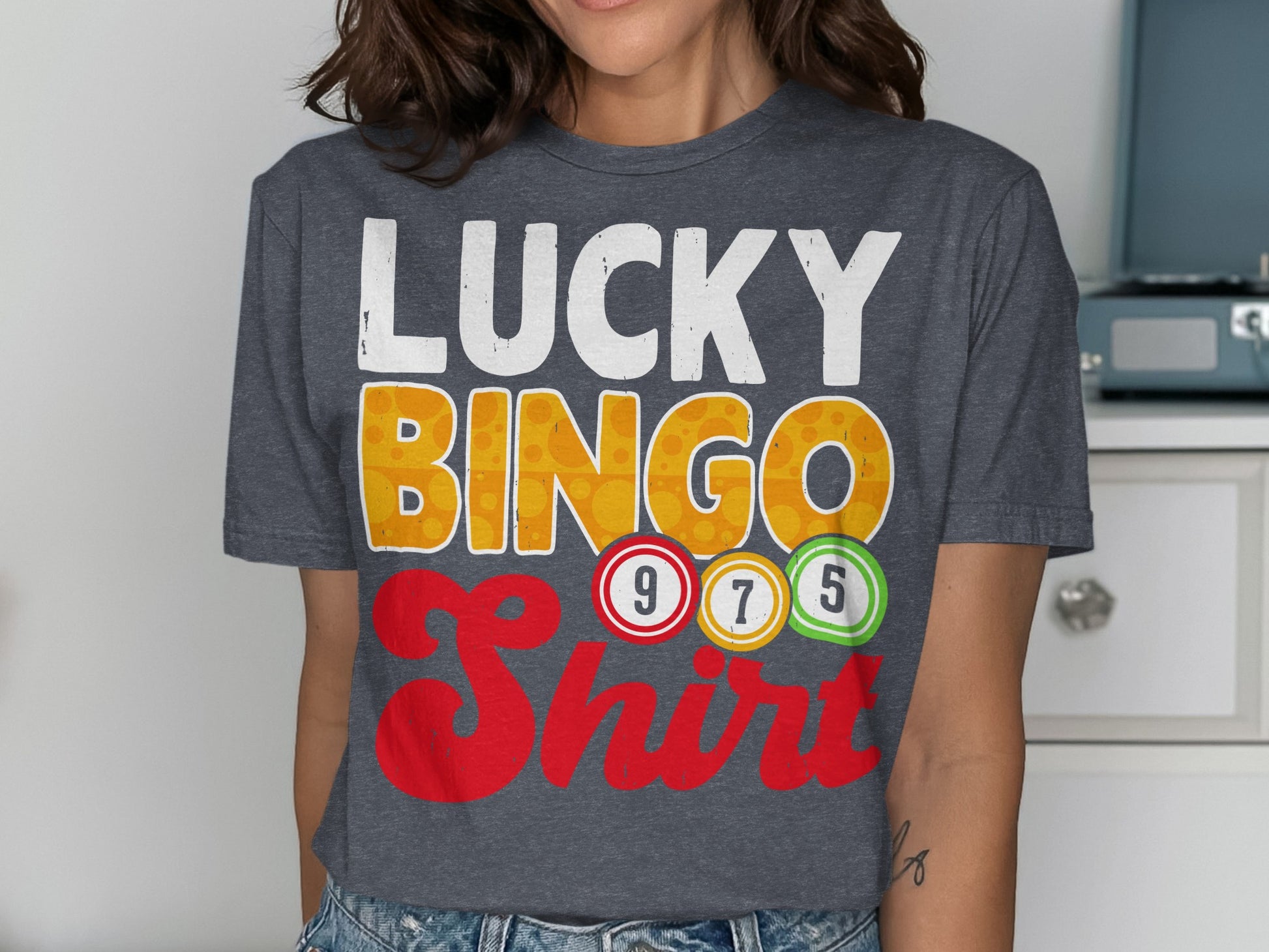 Dark grey t-shirt with "LUCKY BINGO" and colorful bingo balls.