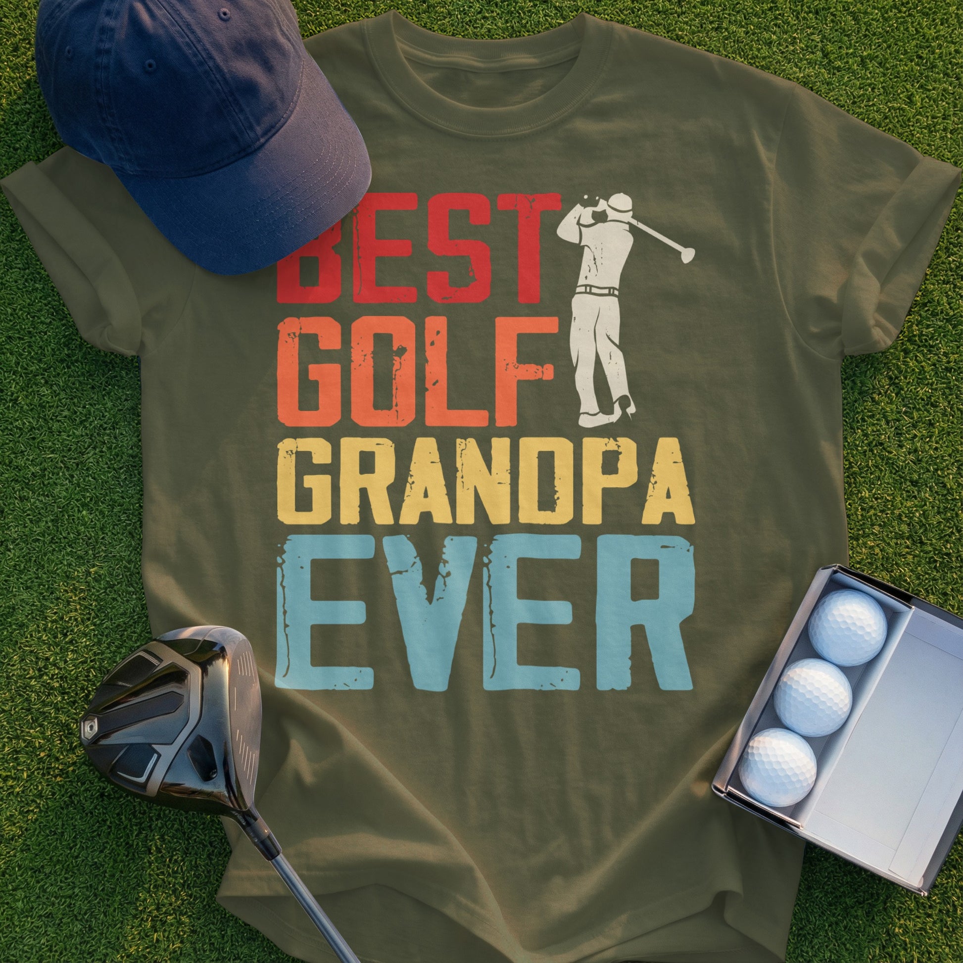 Olive green t-shirt with "BEST GOLF GRANDPA EVER" text and golf elements.