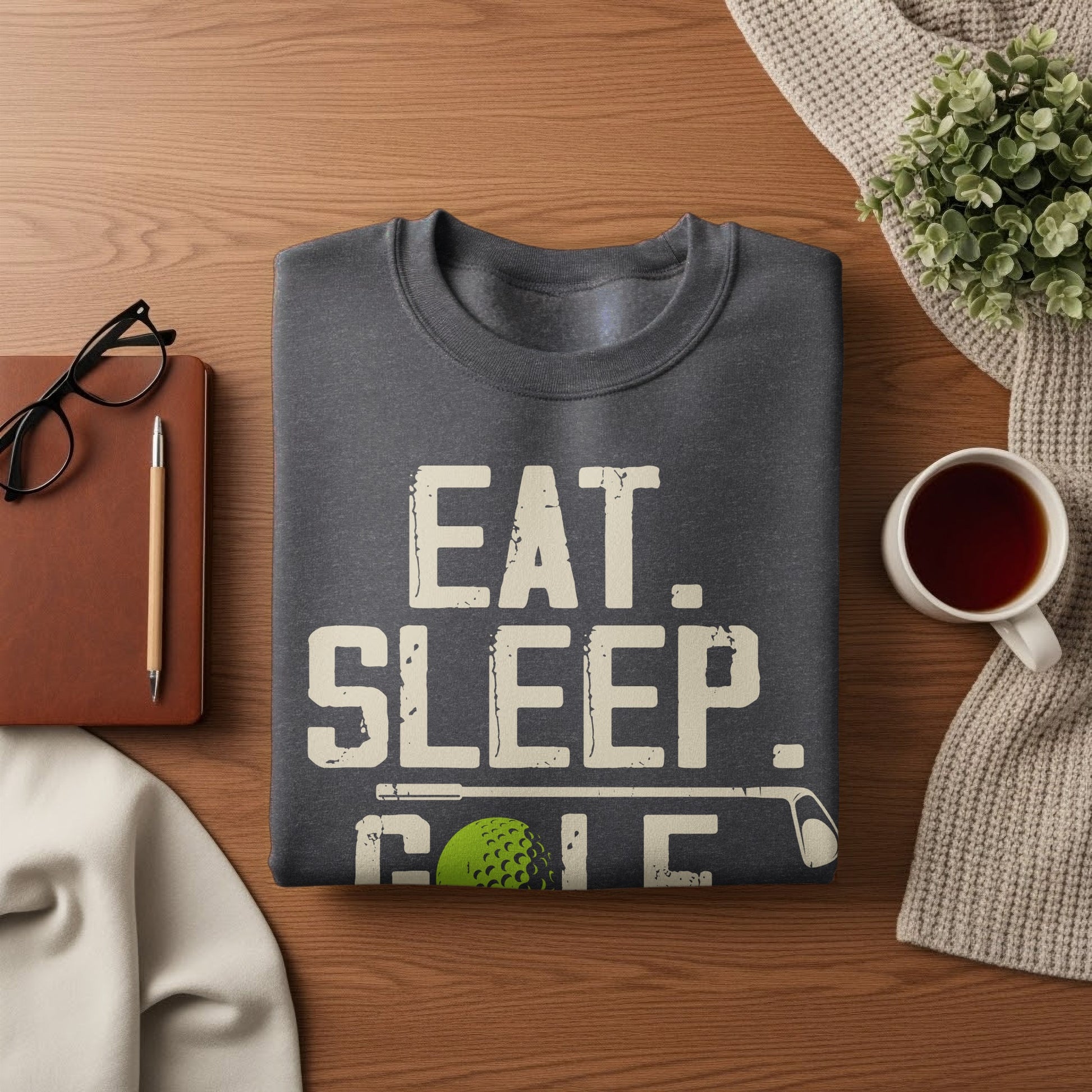 Dark gray sweatshirt with "EAT. SLEEP. GOLF." and golf ball graphic.