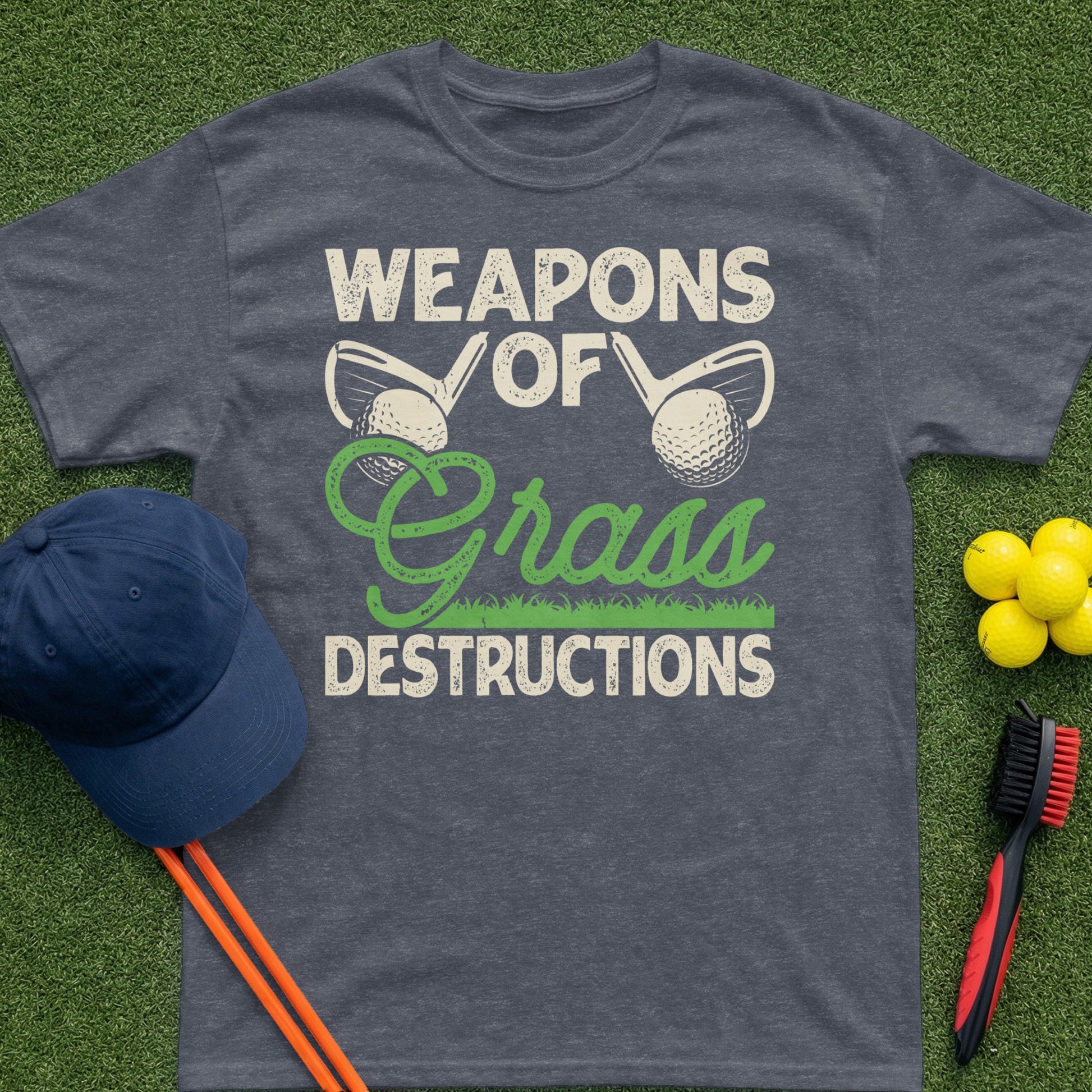 Dark grey t-shirt with "Weapons of Grass Destructions" text and golf club graphics.