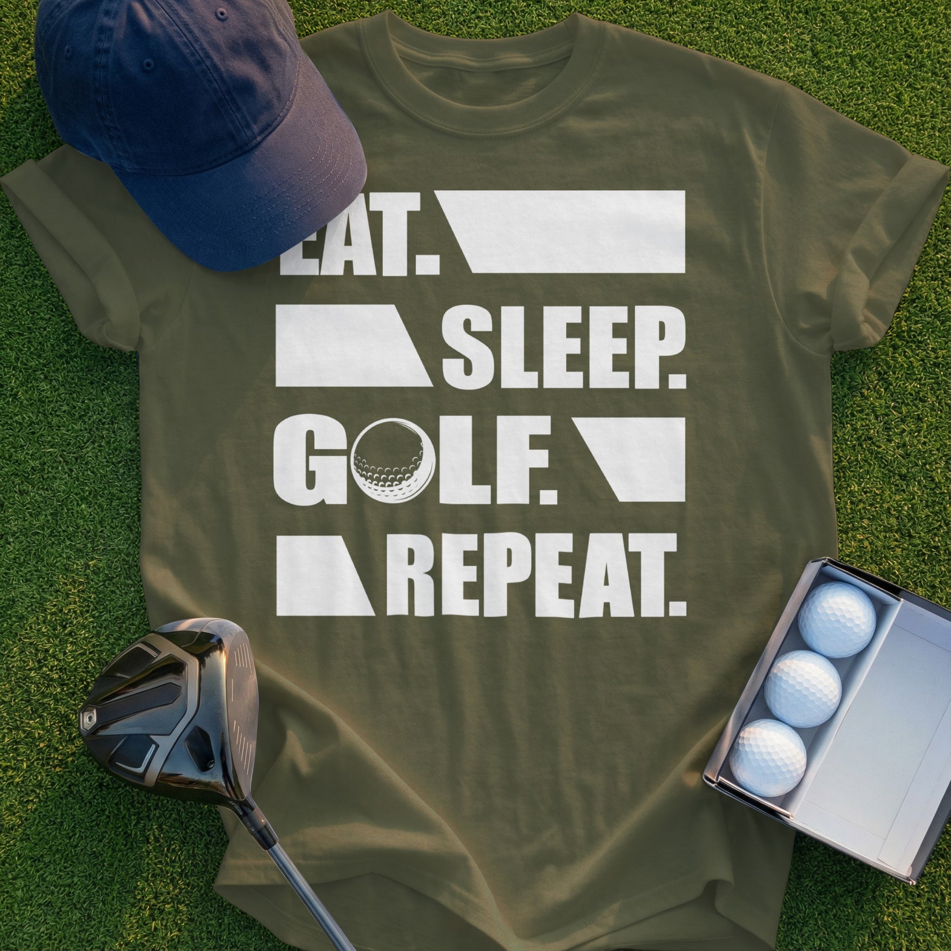 Olive green t-shirt with "EAT. SLEEP. GOLF. REPEAT." text and golf accessories.