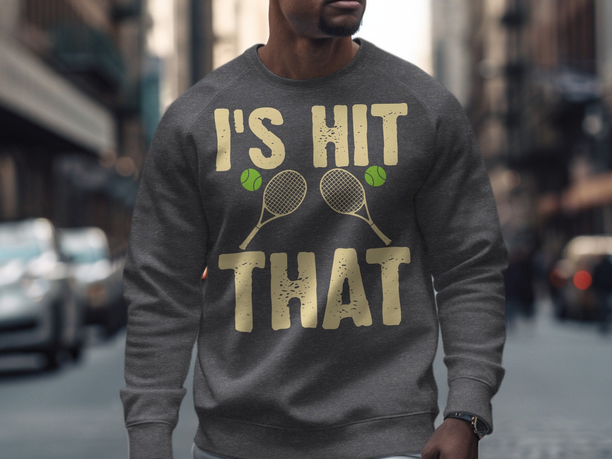 Gray sweatshirt with "I'S HIT THAT" text and tennis rackets.