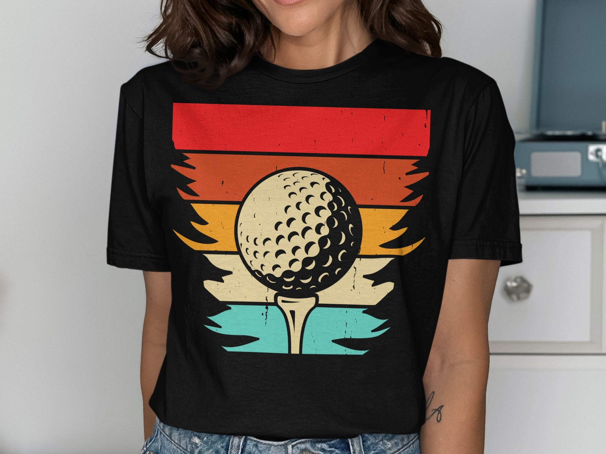 Golf ball on tee with sunset stripe background on a t-shirt.