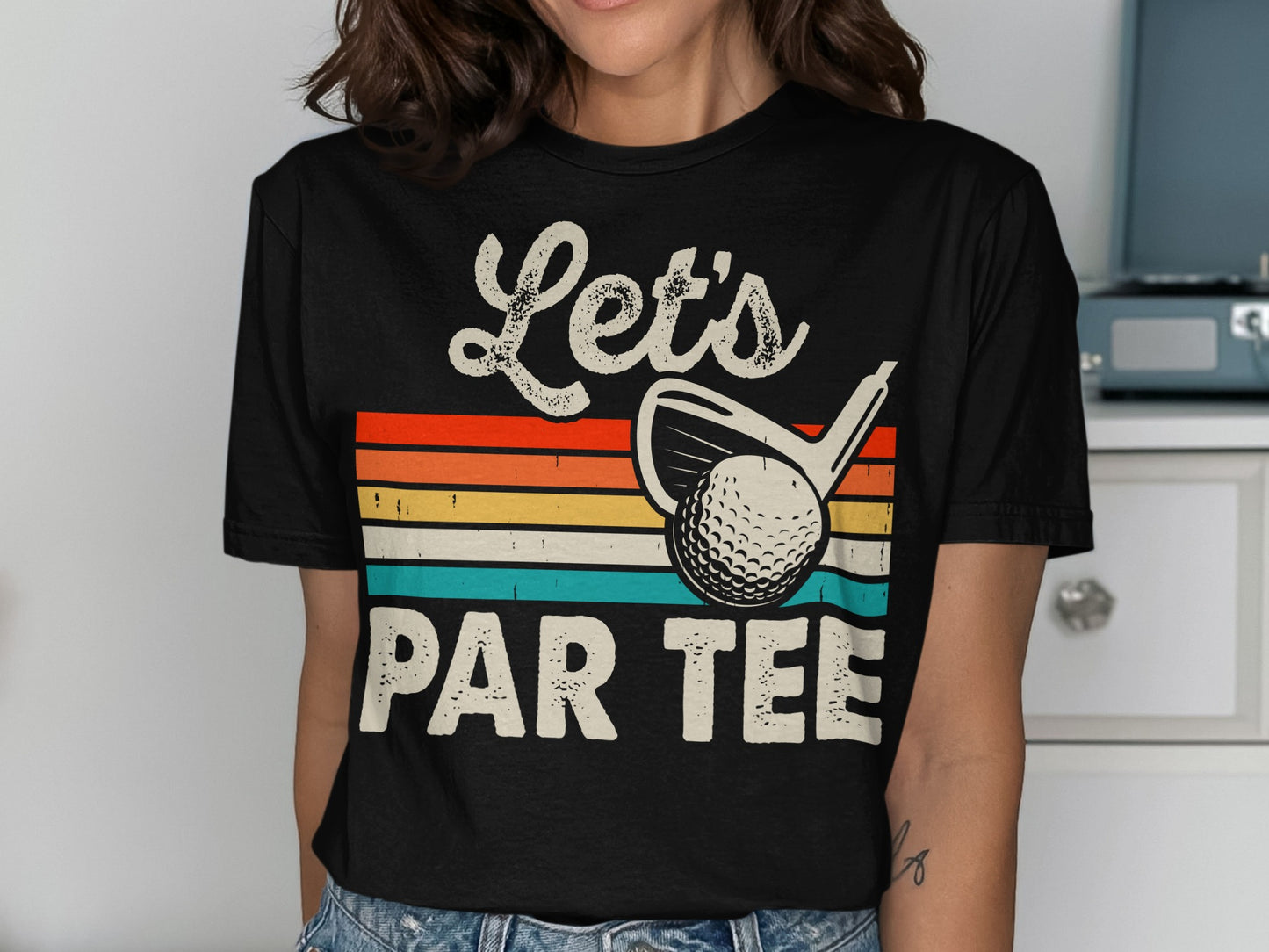 Black t-shirt with "Let's Par Tee" text, golf club, and ball.
