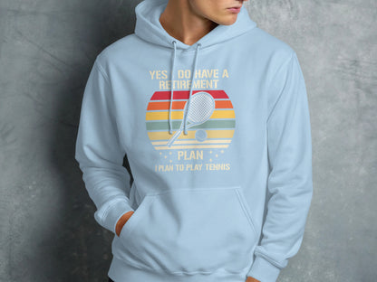 Light blue hoodie with "Yes I Do Have A Retirement Plan I Plan To Play Tennis" text.