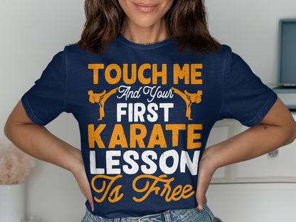 Navy t-shirt with orange and white text: "Touch me and your first karate lesson is free."