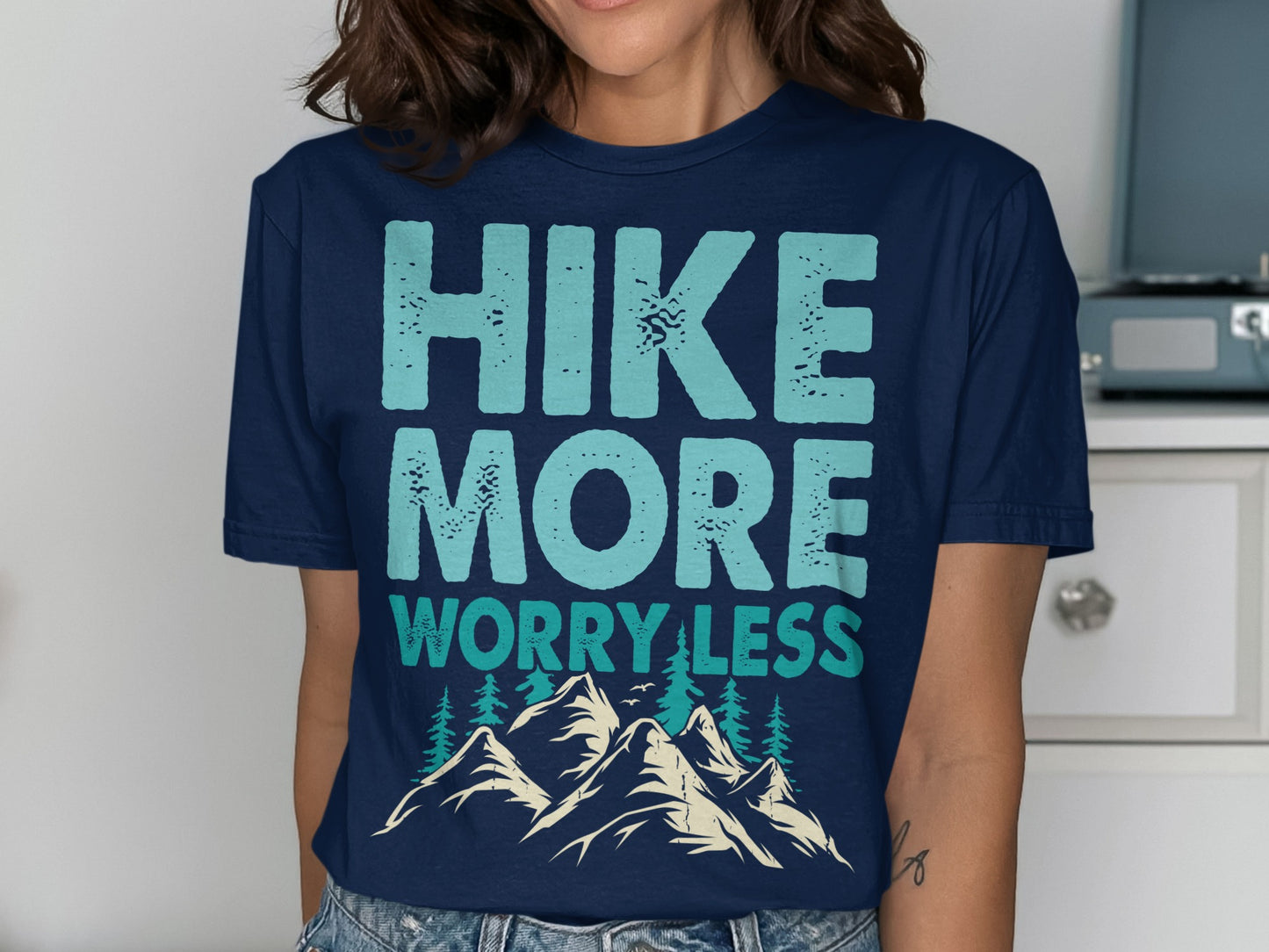 Navy t-shirt with "HIKE MORE WORRY LESS" text and mountain graphic.