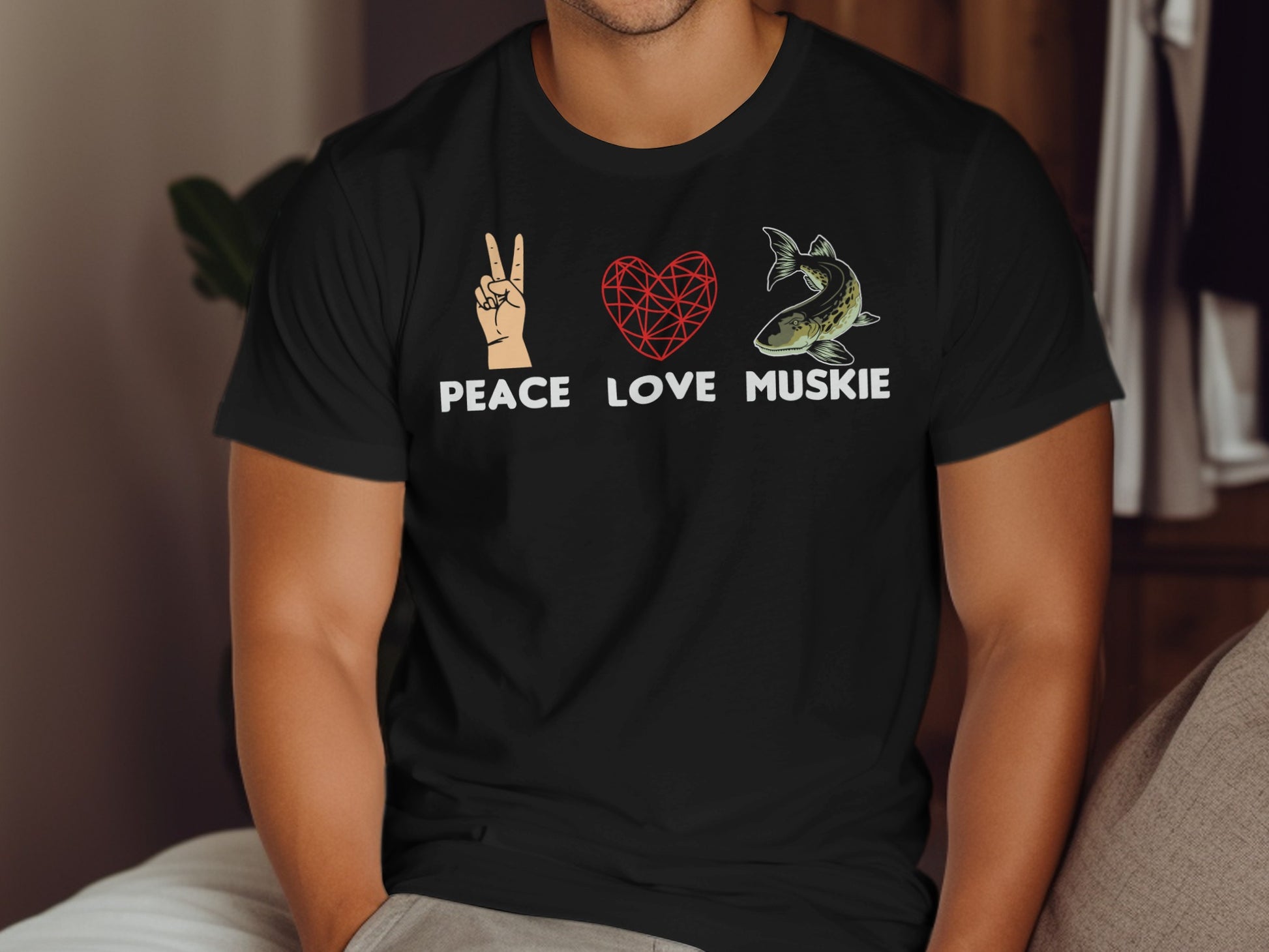 Black t-shirt with peace sign, heart, and muskie graphic, text "Peace Love Muskie".