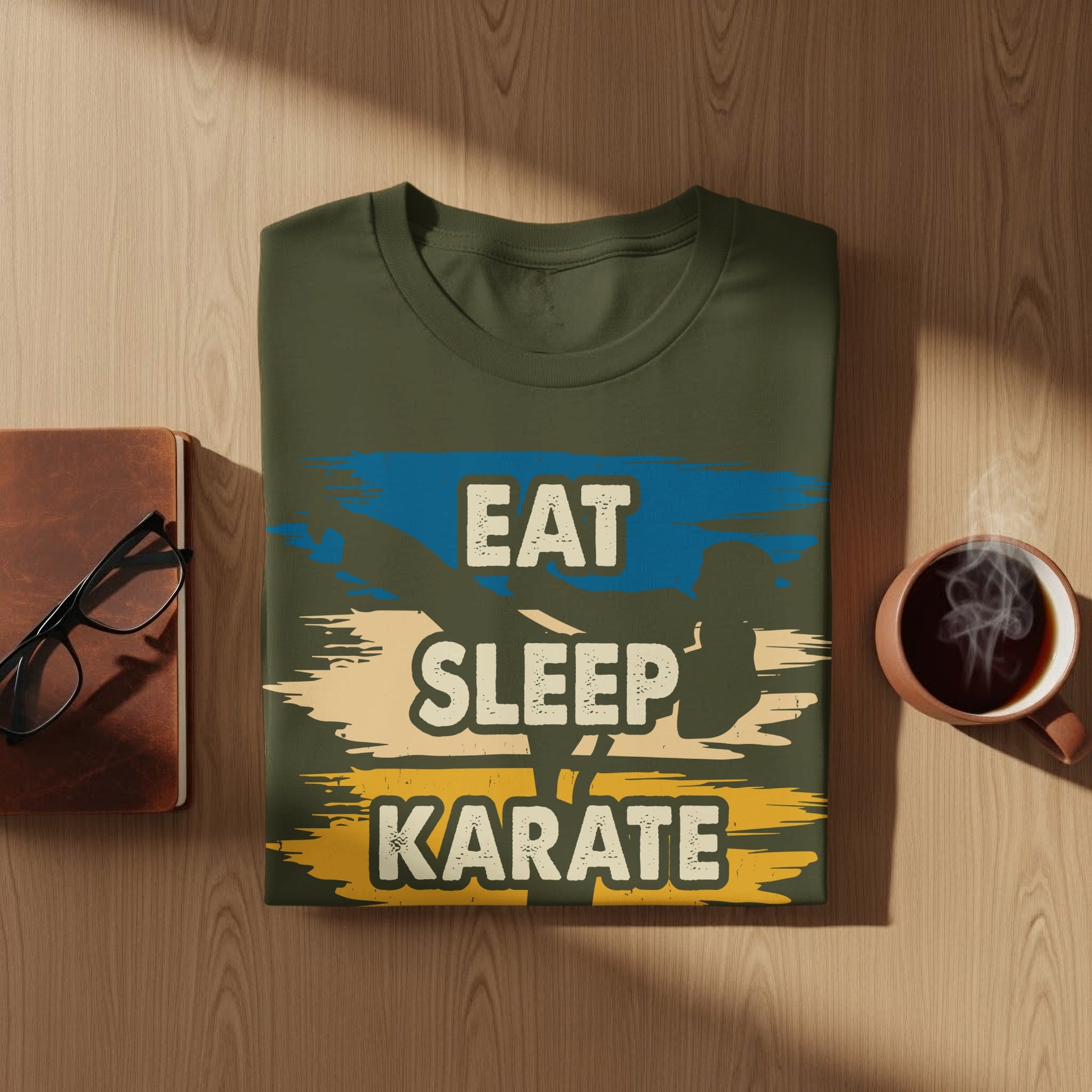 Olive green t-shirt with "Eat Sleep Karate" graphic and blue and yellow stripes.