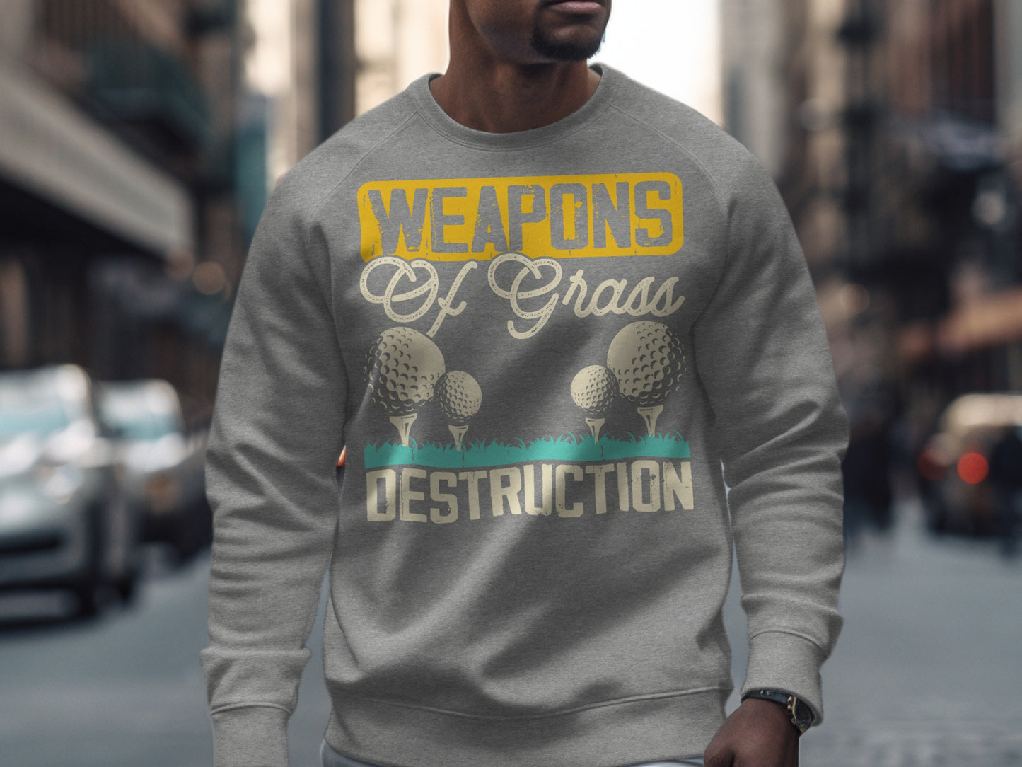 Gray sweatshirt with "Weapons of Grass Destruction" and golf balls.