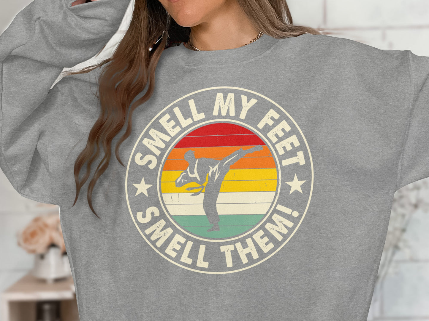 Grey sweatshirt with "Smell My Feet, Smell Them!" and a karate silhouette.