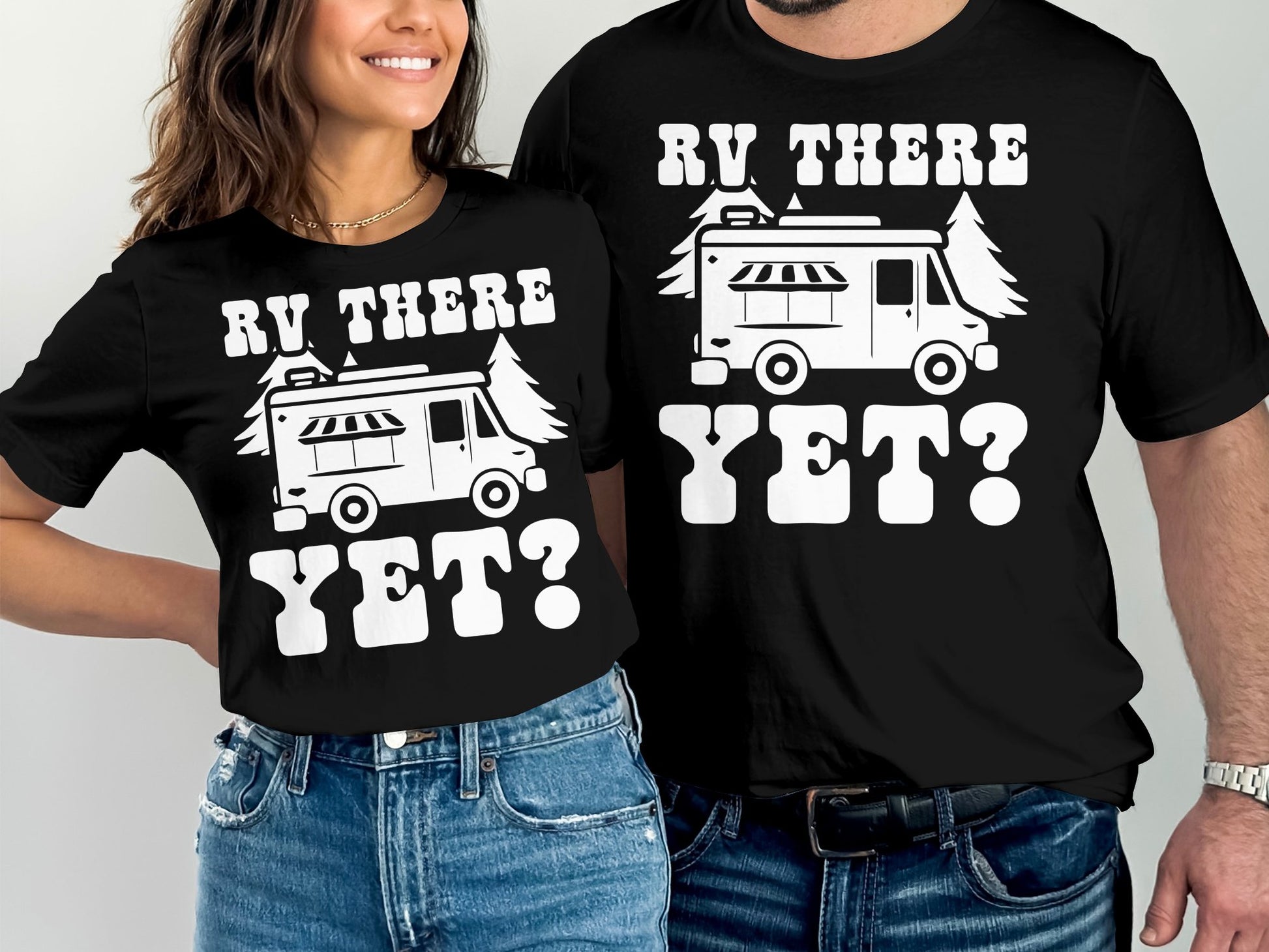 Couple wearing matching black t-shirts with "RV THERE YET?" and RV graphic.