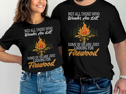 Two black t-shirts with text "Not All Those Who Wander Are Lost" and "Looking for Firewood."