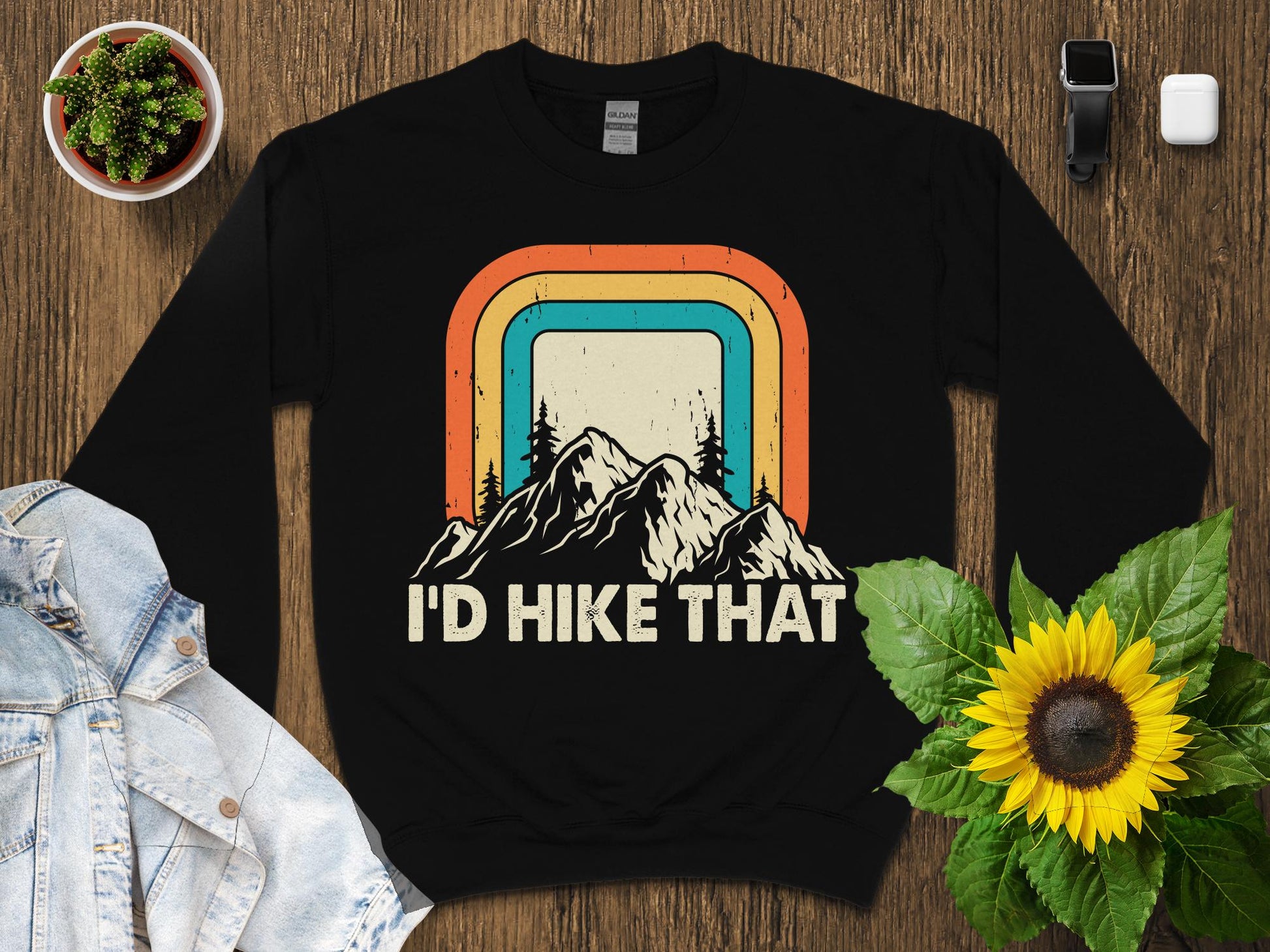 Black sweatshirt with vintage mountain sunset graphic and text "I'd Hike That".