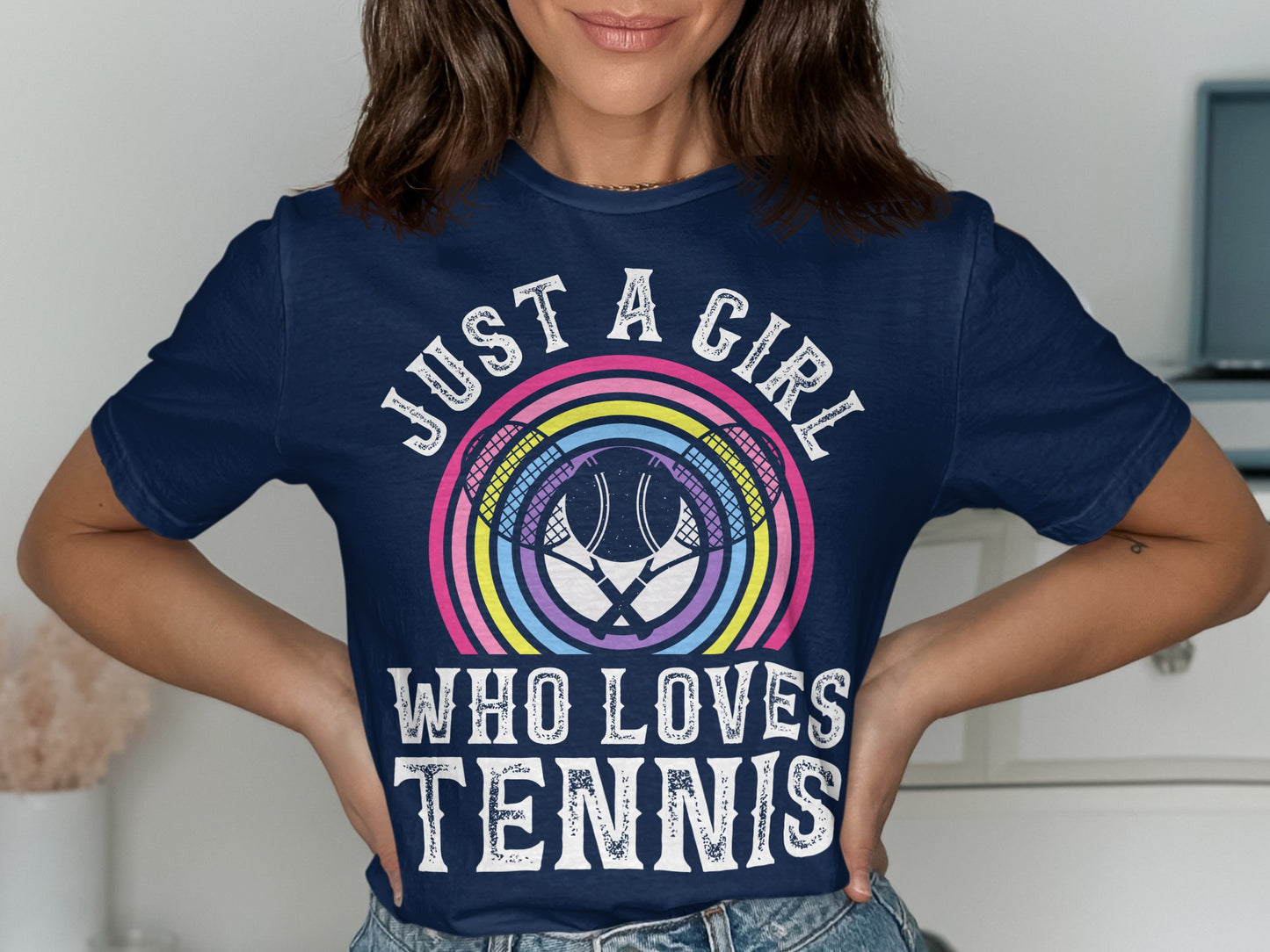 Navy t-shirt with "Just a girl who loves tennis" slogan and tennis racket graphic.