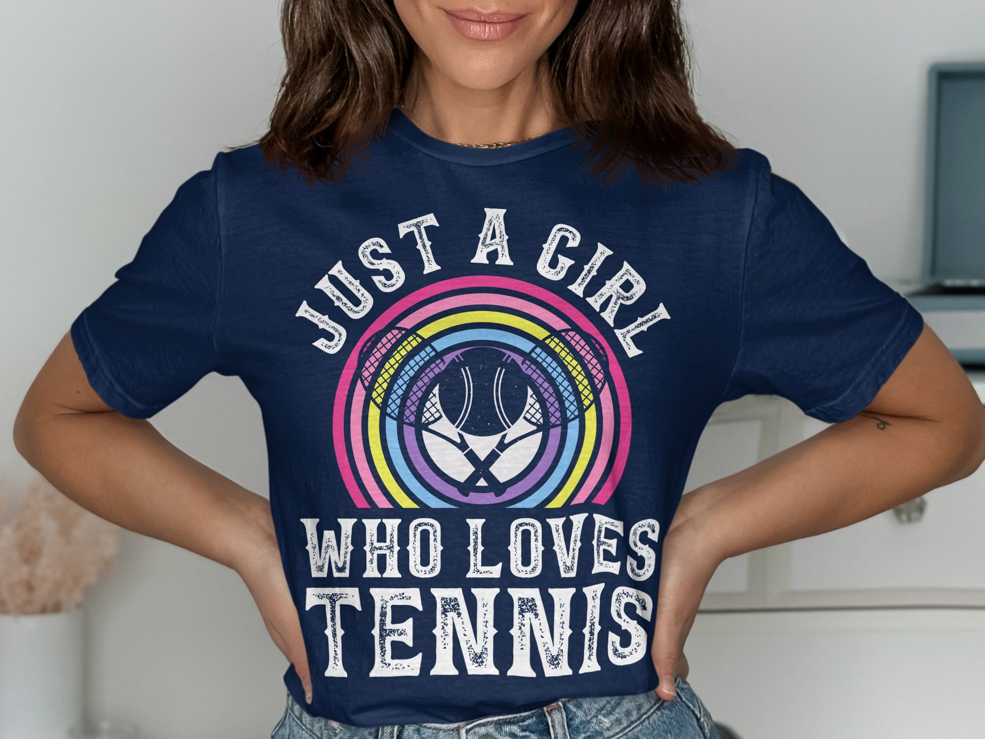 Navy t-shirt with "Just a girl who loves tennis" slogan and tennis racket graphic.