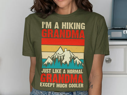 T-shirt with text "I'm a hiking grandma, just like a normal grandma except much cooler" and mountain graphic.
