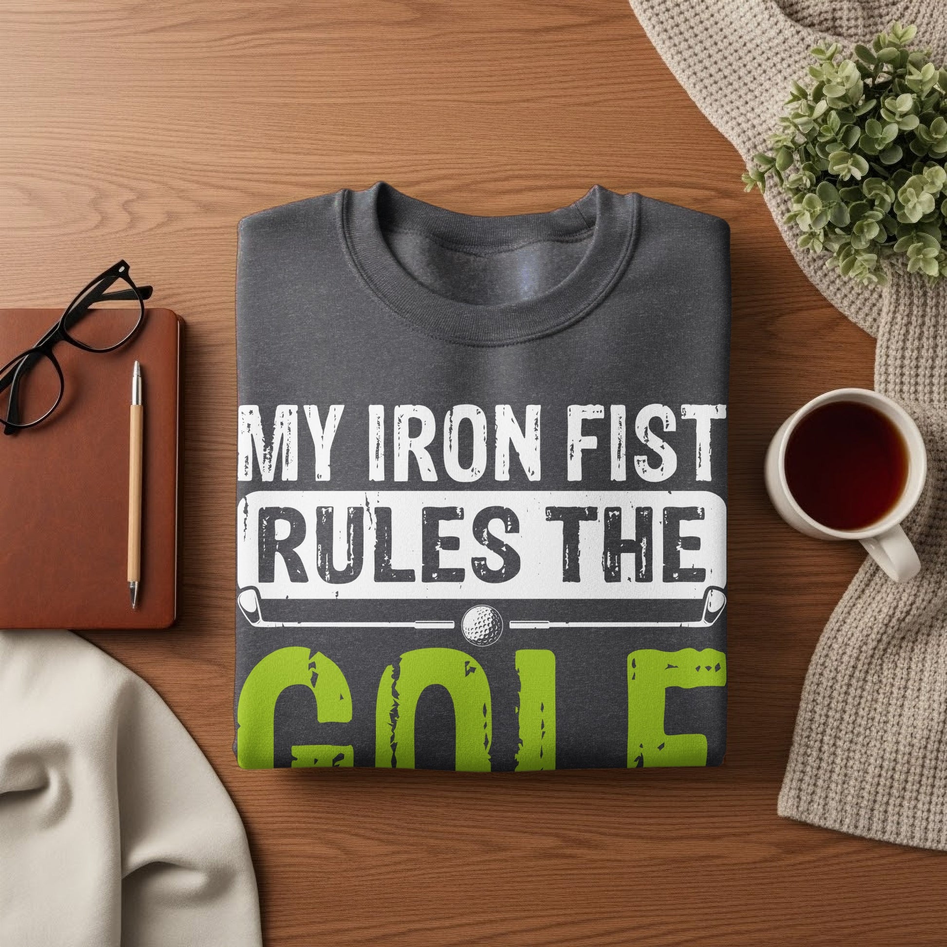 Dark gray sweatshirt with "My Iron Fist Rules the Golf" text and graphic.