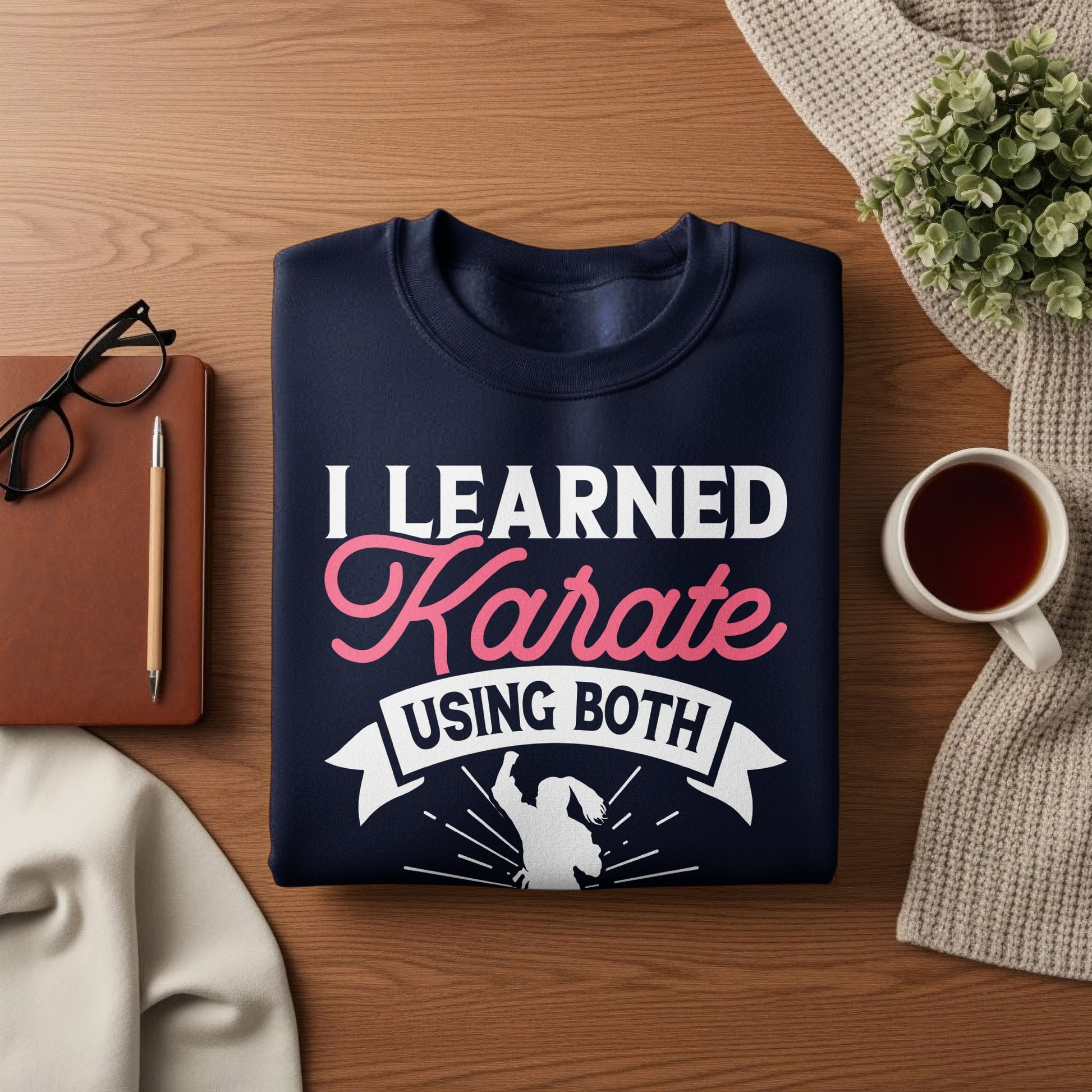 Navy sweatshirt with "I LEARNED Karate USING BOTH" in white and pink text.