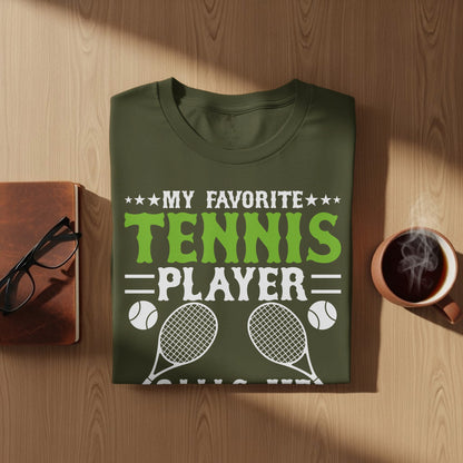 Olive green t-shirt with "My Favorite Player" text and tennis graphics.