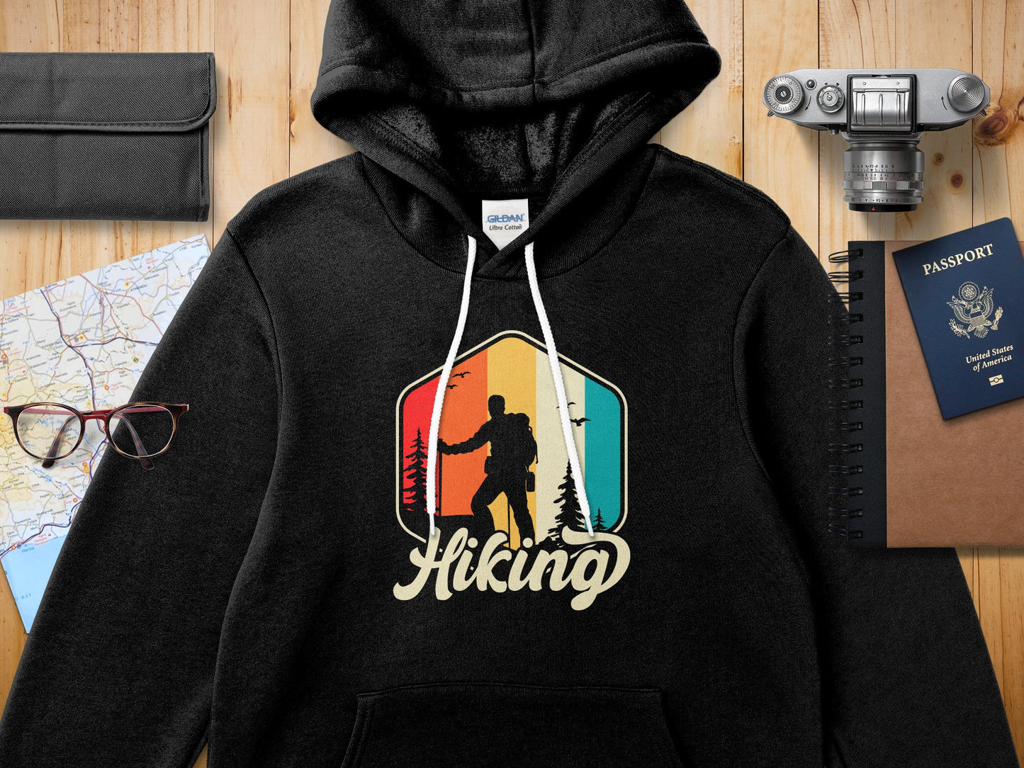 Black Gildan hoodie with hiking graphic and text.