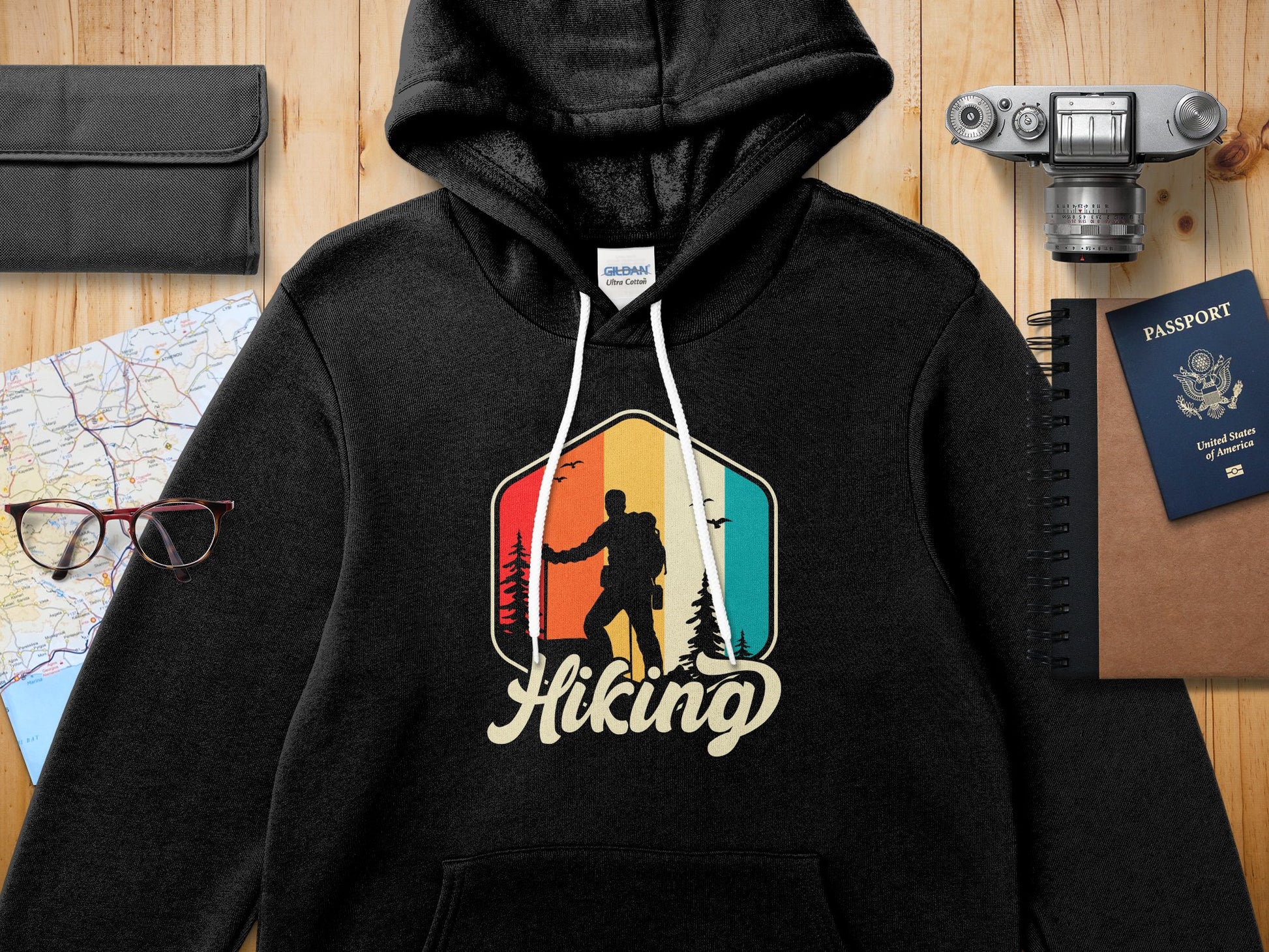 Black Gildan hoodie with hiking graphic and text.
