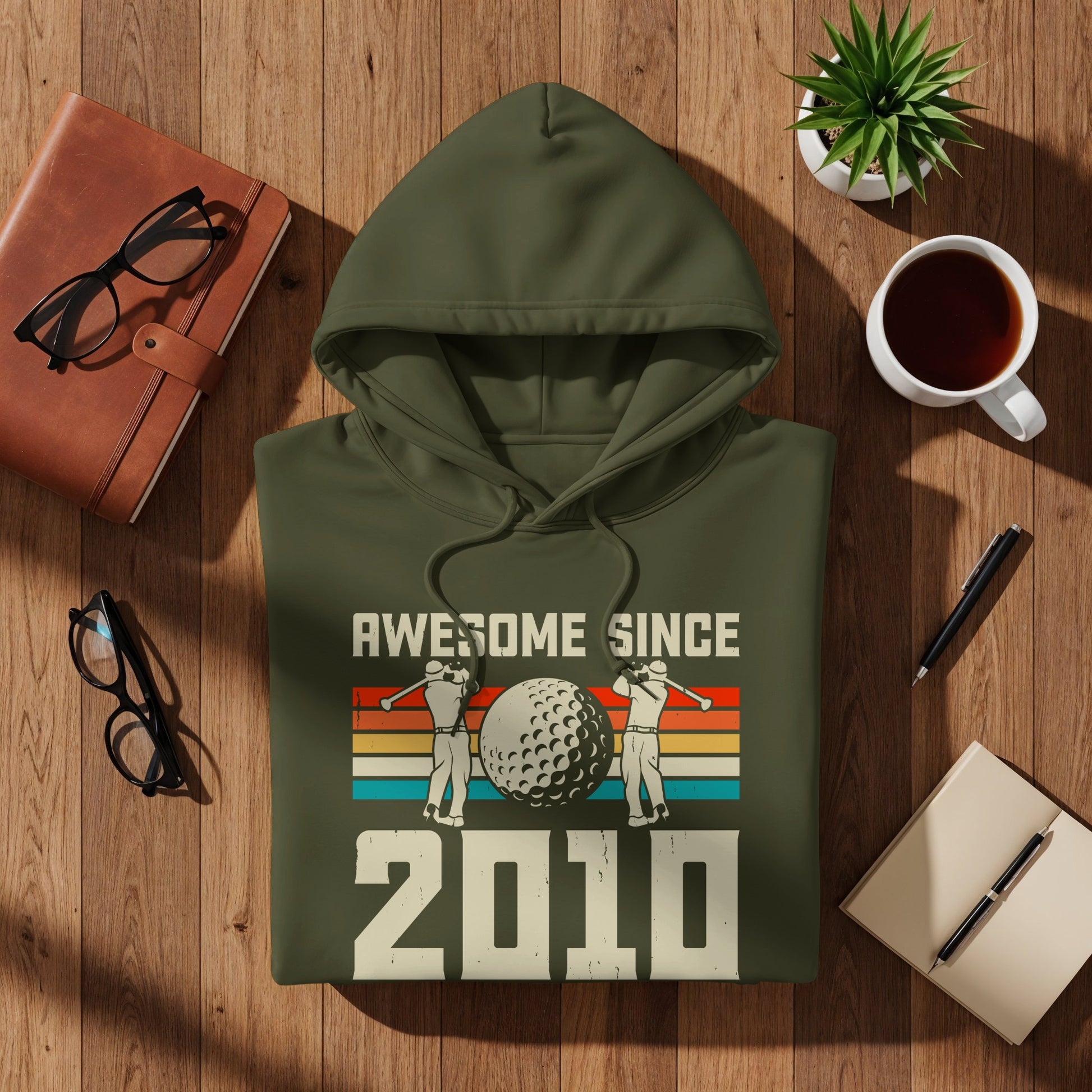 Olive green hoodie with "Awesome Since 2010" and golf graphic.