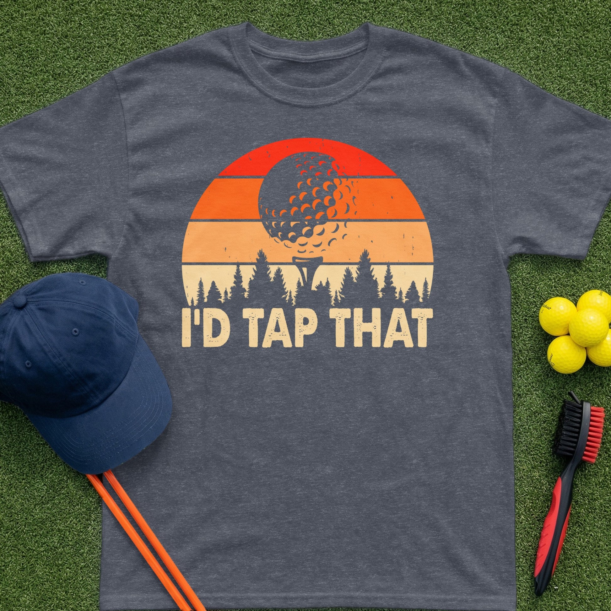 Dark gray t-shirt with "I'd Tap That" text and a golf ball sunset graphic.