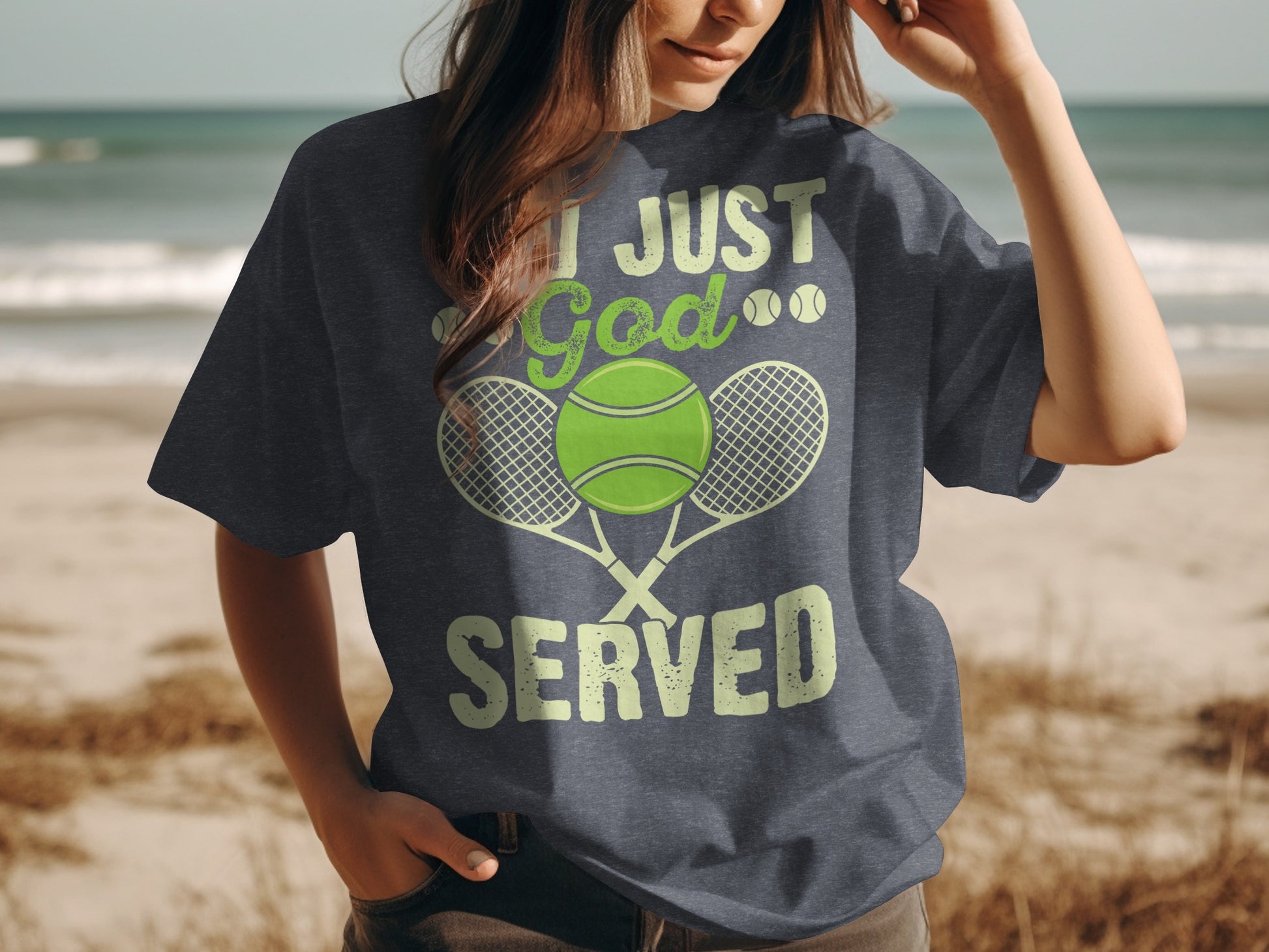 Dark gray t-shirt with "I JUST GOD SERVED" and tennis graphics.