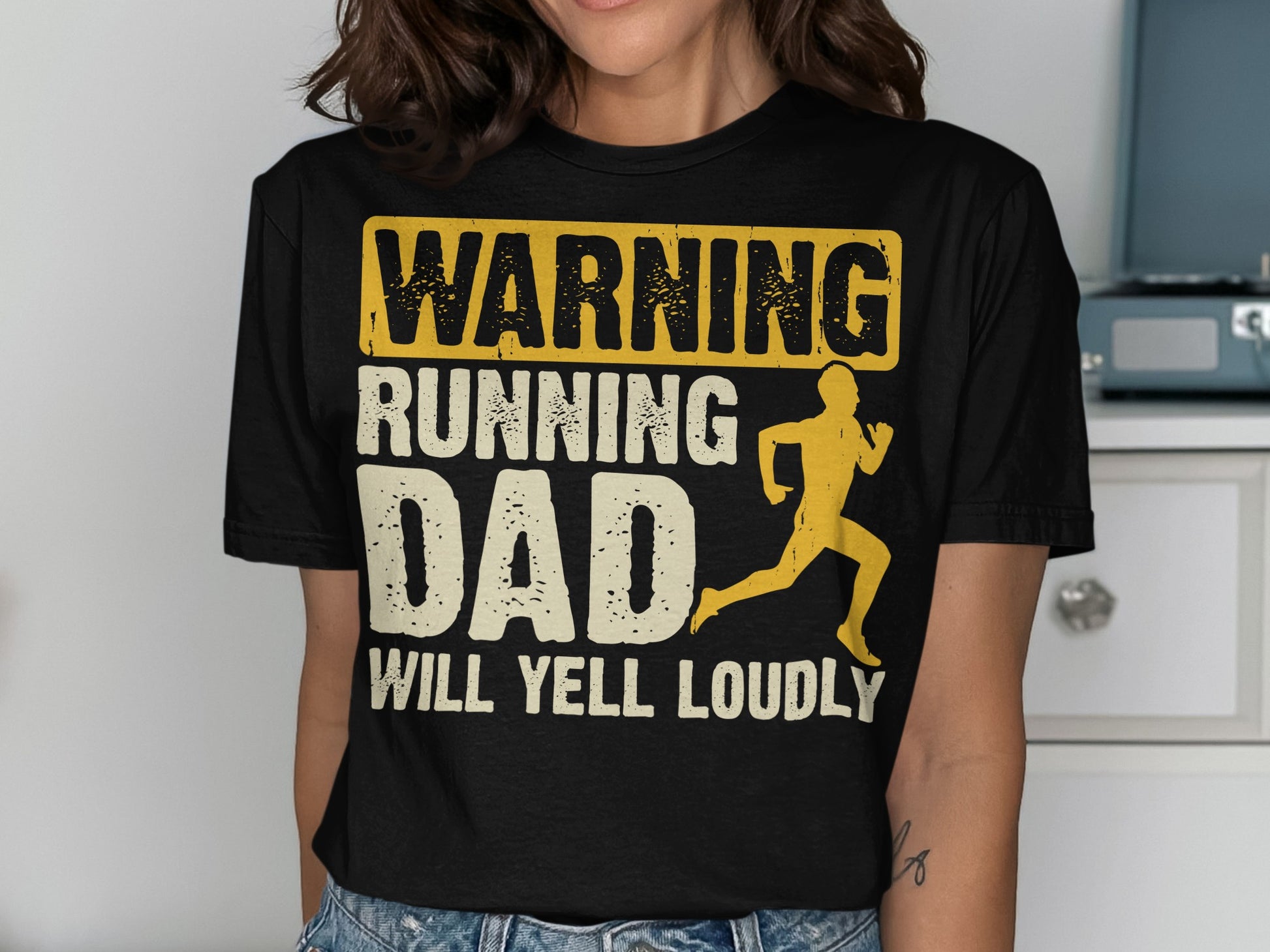 Black t-shirt with "WARNING RUNNING DAD WILL YELL LOUDLY" and runner graphic.