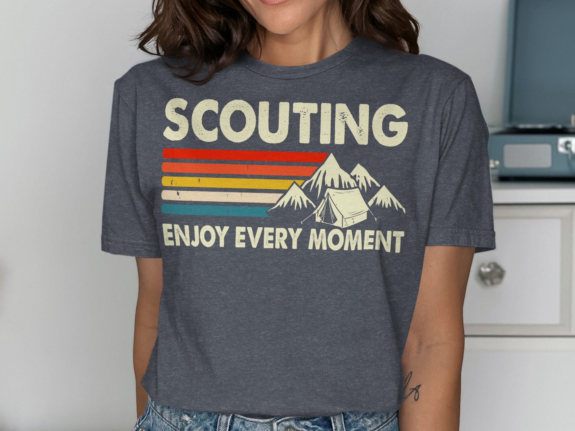 T-shirt with "SCOUTING ENJOY EVERY MOMENT" text, mountain, and tent graphic.