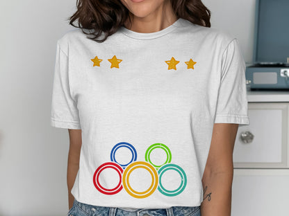 White t-shirt with Olympic rings and three yellow stars.