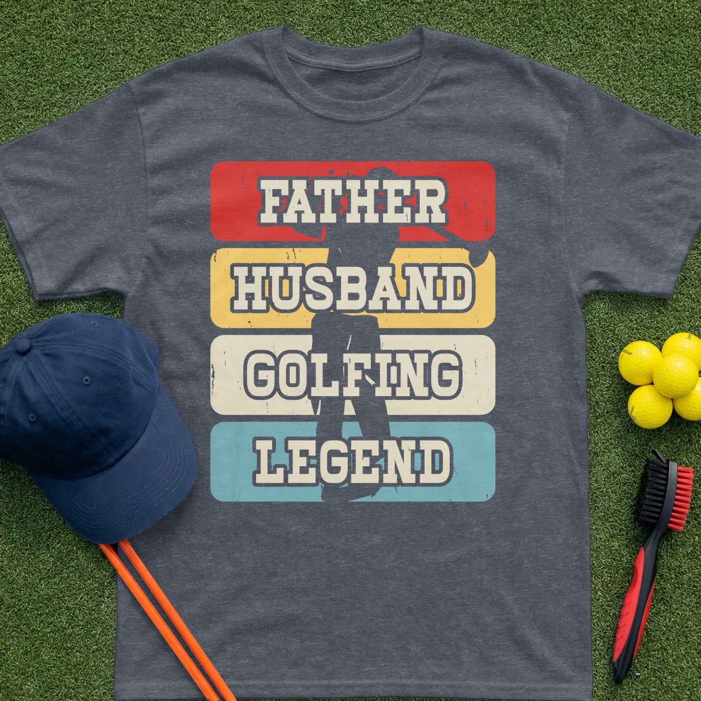 T-shirt with "Father Husband Golfing Legend" text, set against a grass background.