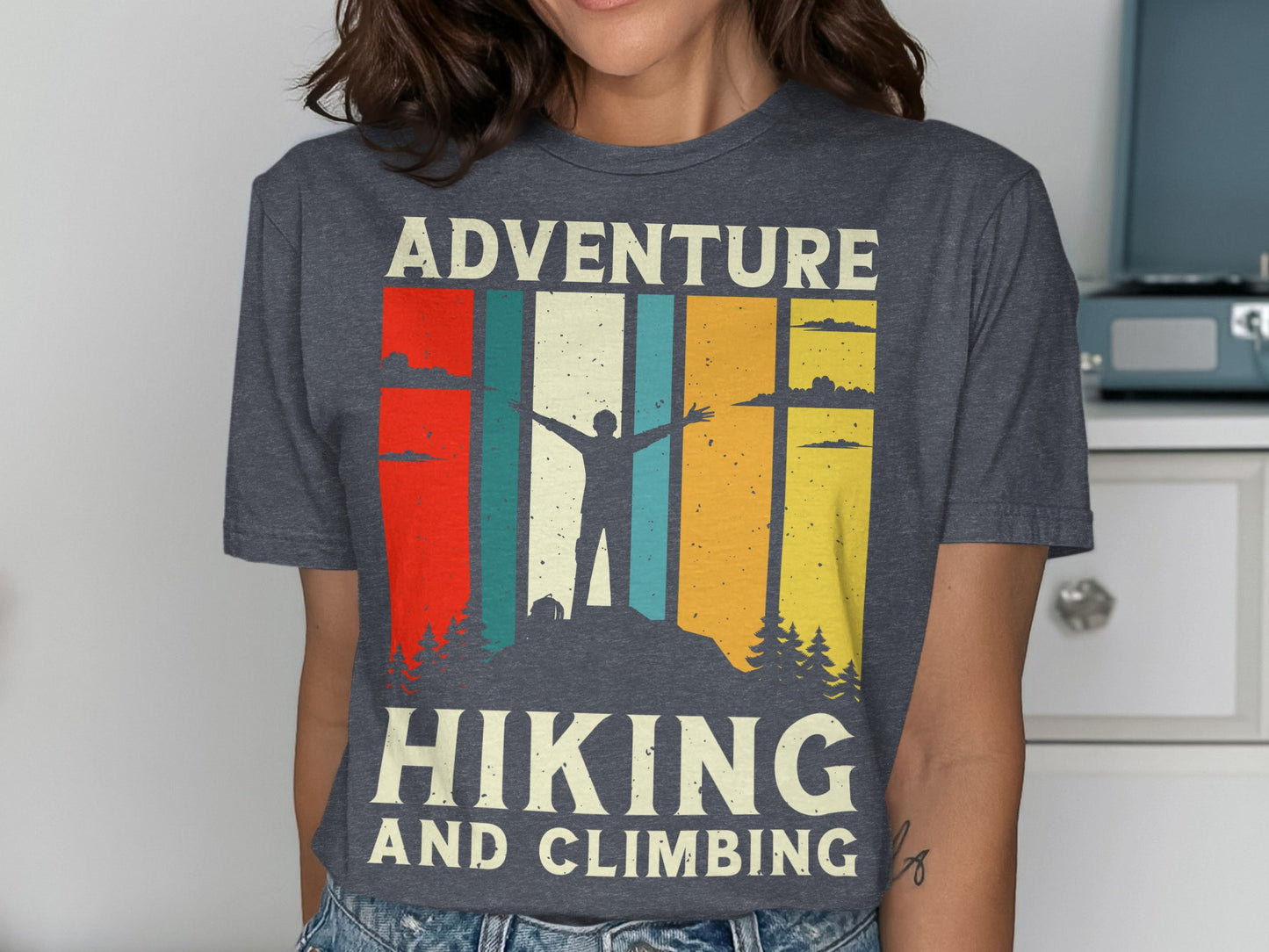 Dark grey t-shirt with abstract mountain sunset and "Hiking and Climbing" text.