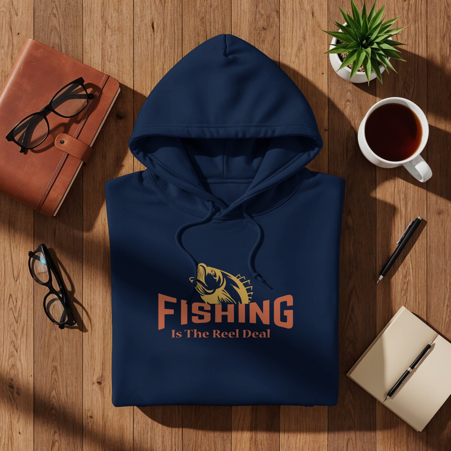Navy blue hoodie with "Fishing Is The Reel Deal" graphic.
