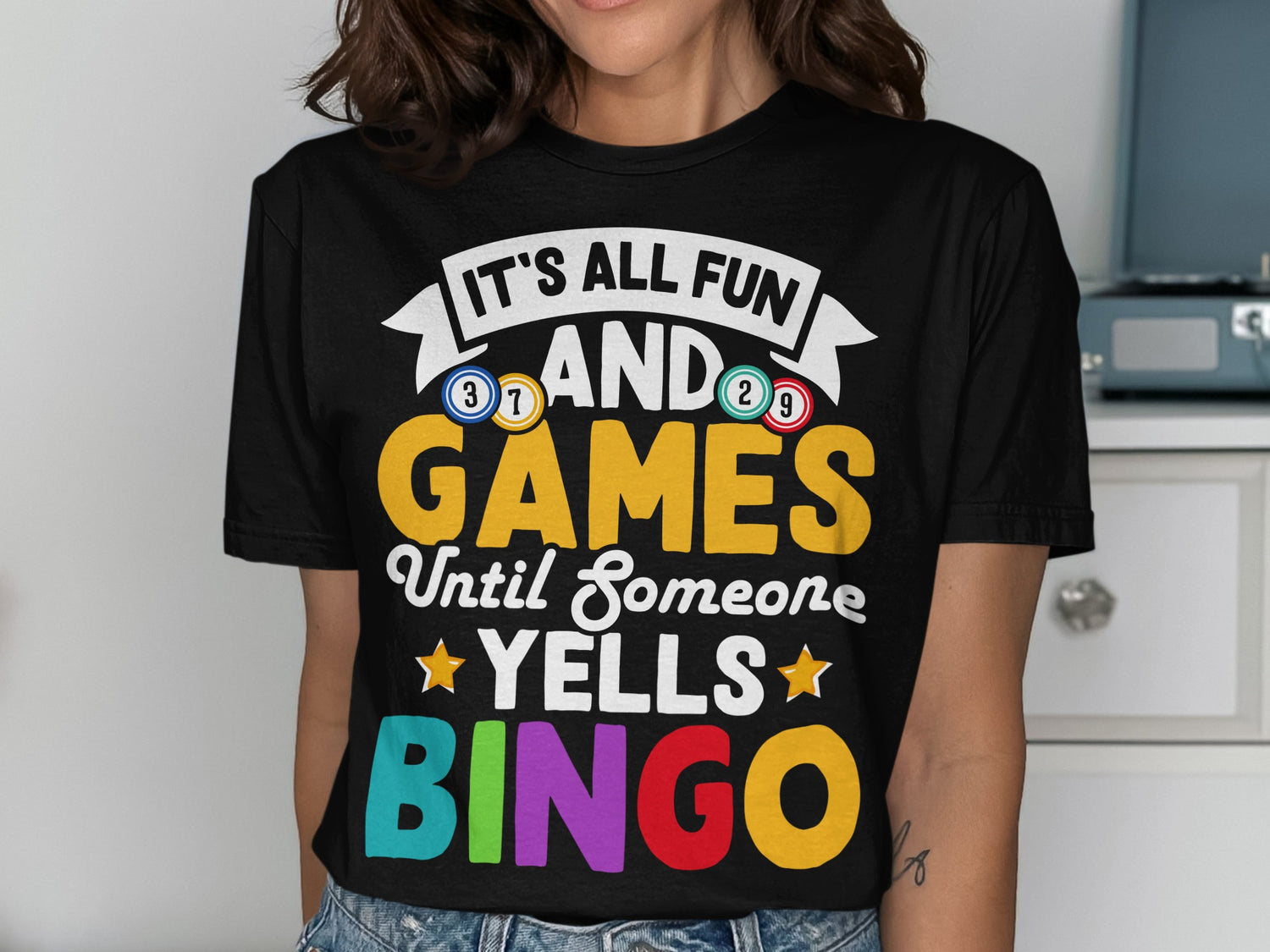 T-shirt with "It's all fun and games until someone yells BINGO" text.