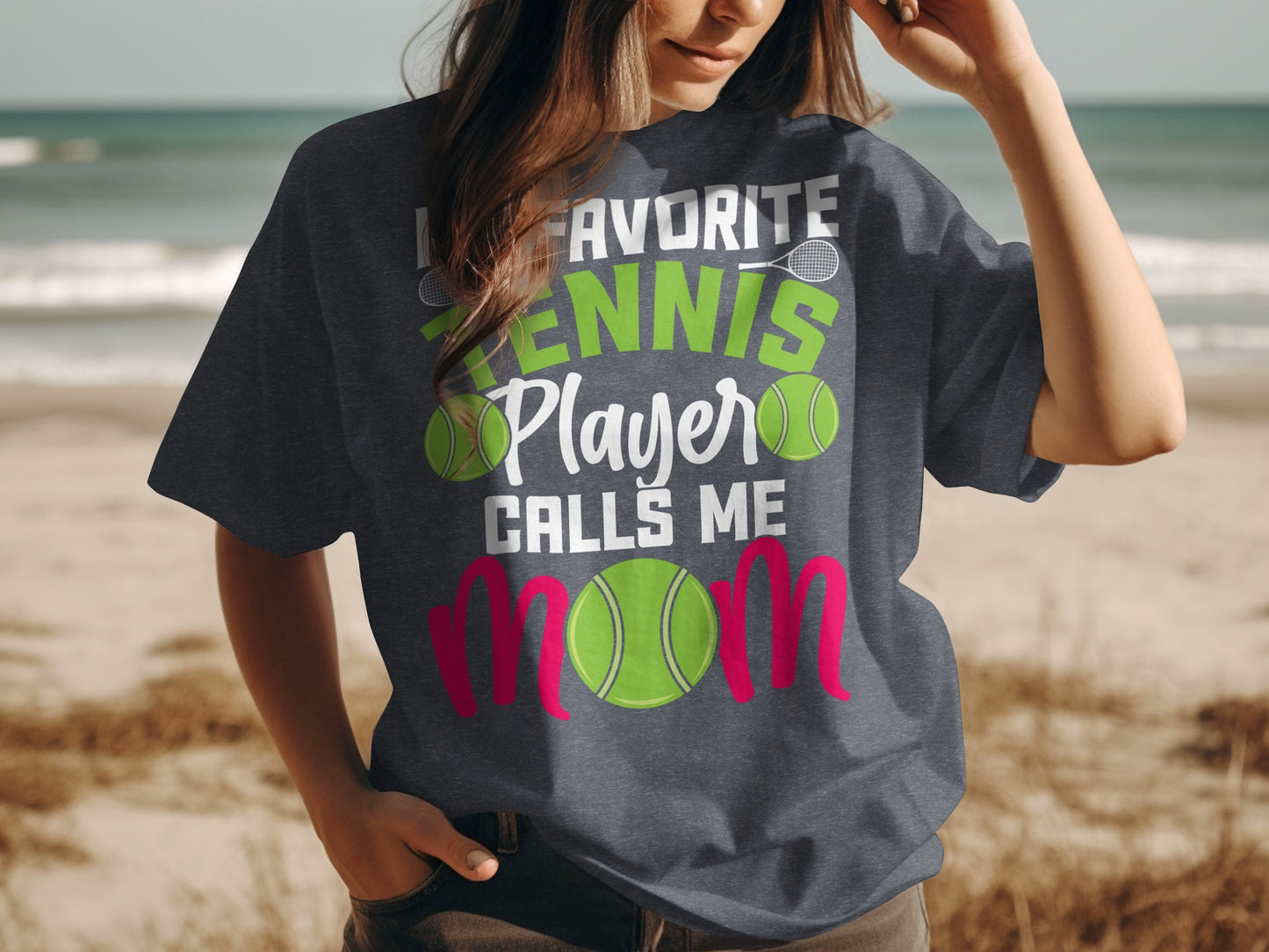 Dark t-shirt with "My Favorite Tennis Player Calls Me Mom" graphic.