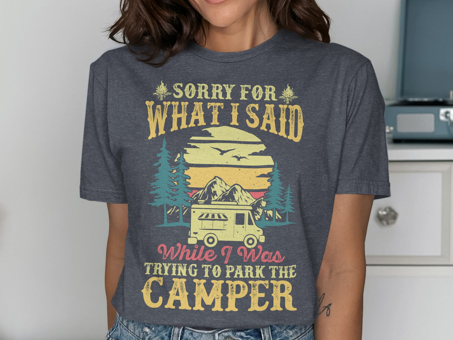 T-shirt with "Sorry for what I said while trying to park the camper" text and camper graphic.